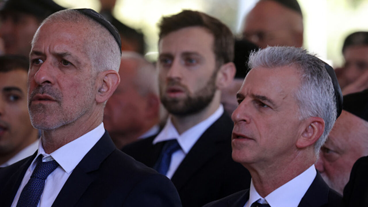 Israel's Chief of the Mossad David Barnea (R) and Security Agency director Ronen Bar, attend a ceremony marking the Hebrew calendar anniversary of the Hamas attack on October 7 last year that sparked the ongoing war in Gaza, at the Mount Herzl military cemetery in Jerusalem on October 27, 2024. (Photo by GIL COHEN-MAGEN / POOL / AFP) (Photo by GIL COHEN-MAGEN/POOL/AFP via Getty Images)