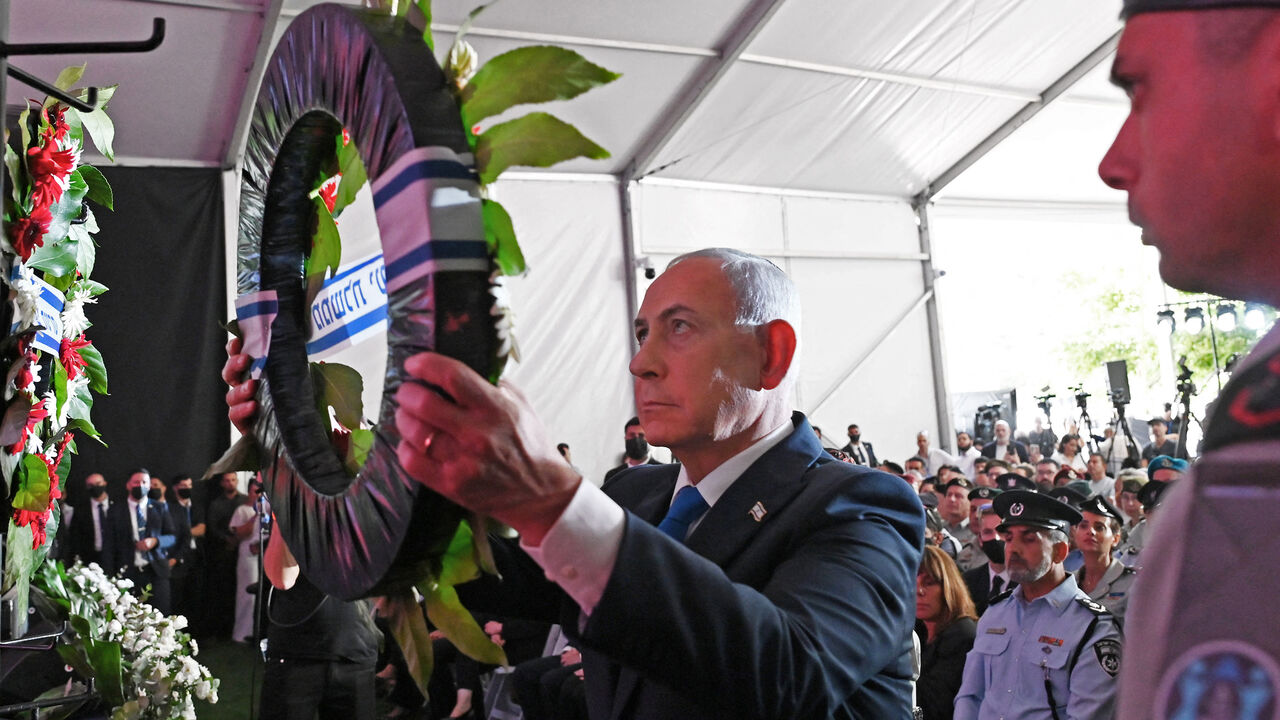 Israeli Prime Minister Benjamin Netanyahu lays a wreath during the state memorial ceremony for the third anniversary of the Oct. 7 attack, at Mount Herzl military cemetery, Jerusalem, Oct. 5, 2026.