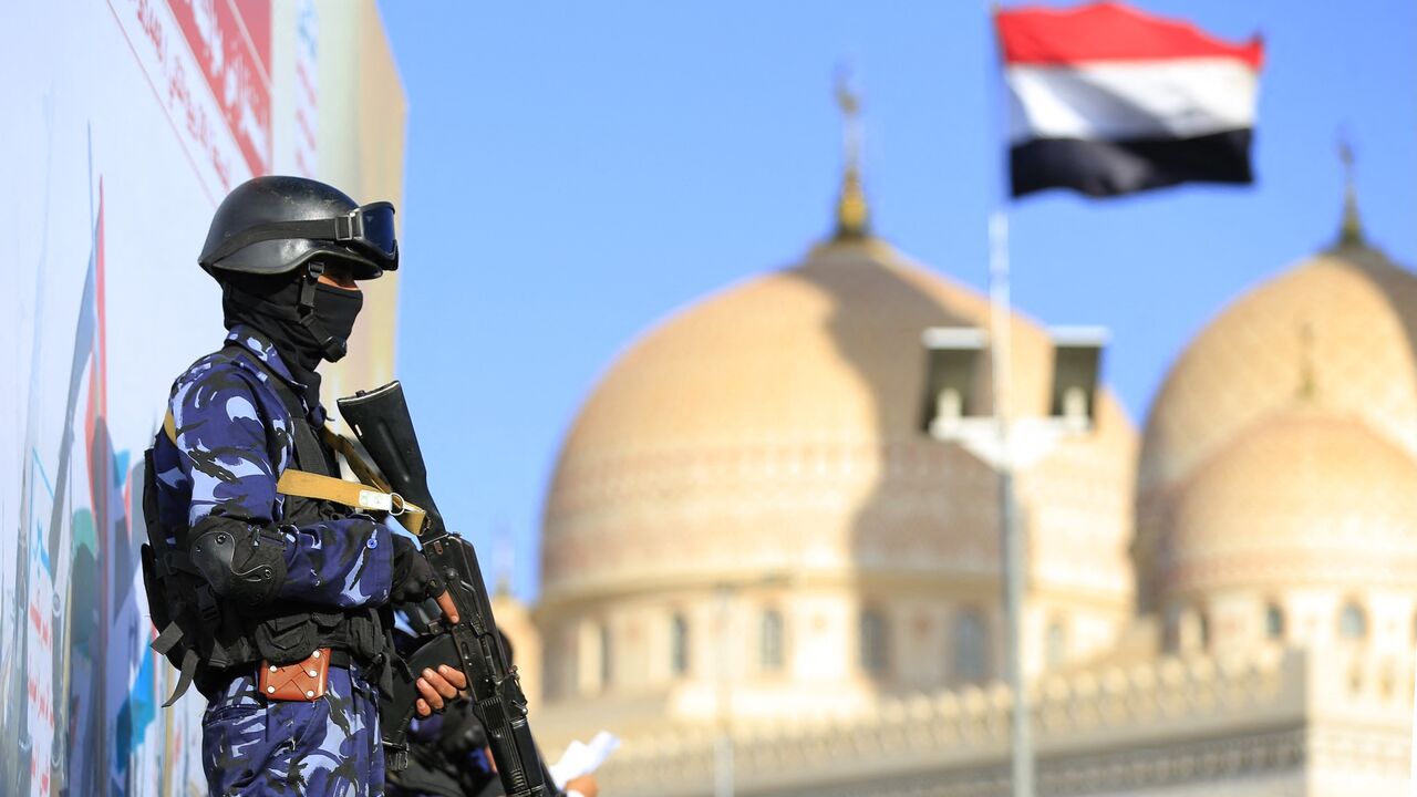 A security force member stands guard during a protest against Saudi intervention in Yemen, in Sanaa, on Oct. 9, 2026. 