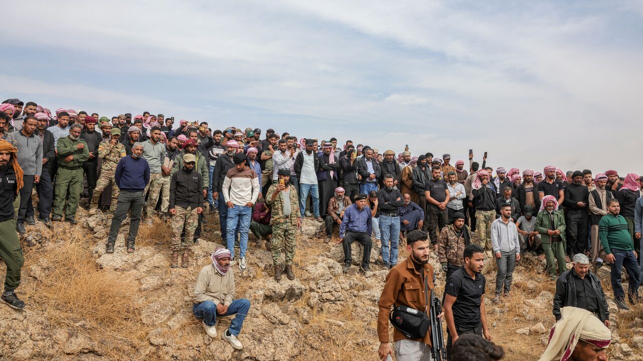 Mourners attend the funeral of those who were killed in airstrikes carried out by Jordan the night before on the village of Al-Taf in the Al-Lajat region, located in the northeastern countryside of Daraa, on Oct. 27, 2026. 