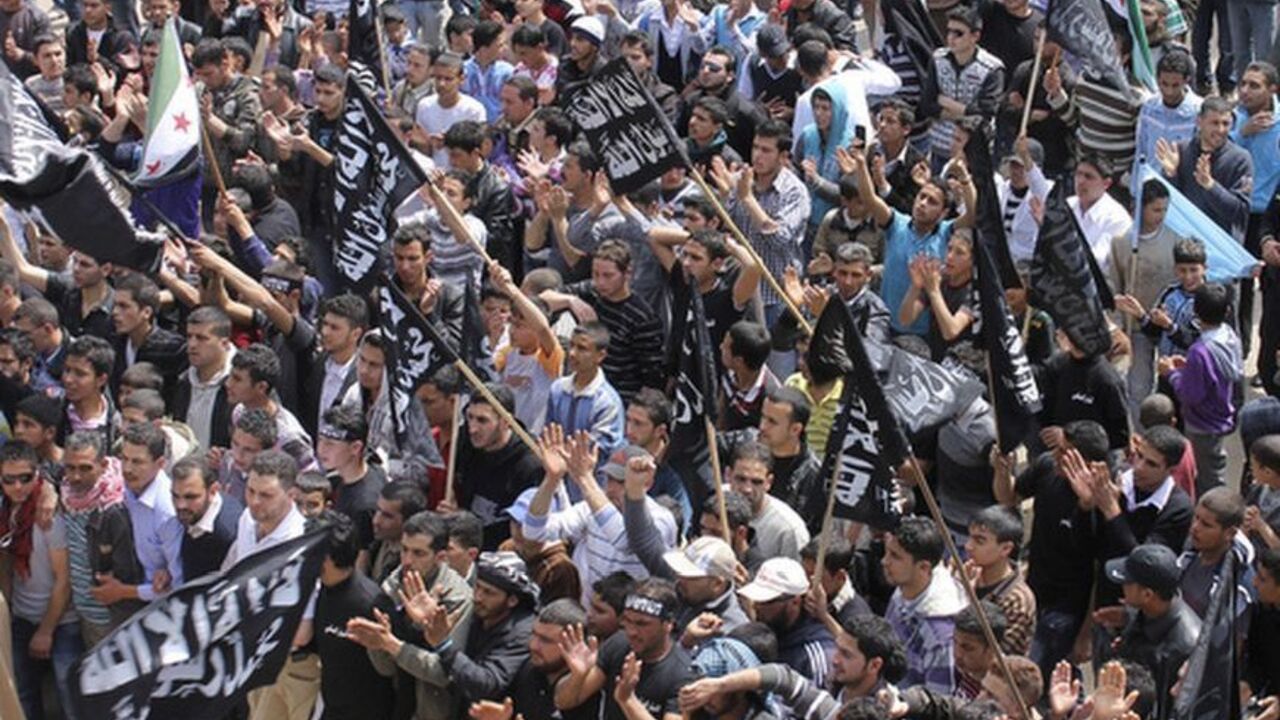 Syrian and Lebanese protesters chant slogans against Syrian President Assad during a protest organized by Sunni Muslim Salafist group in solidarity with Syria's anti-government protesters, in Wadi Khaled village Syrian and Lebanese protesters chant slogans against Syrian President Bashar al-Assad during a protest organized by Sunni Muslim Salafist group in solidarity with Syria's anti-government protesters, in Wadi Khaled village, north Lebanon April 1, 2012. REUTERS/Roula Naeimeh (LEBANON - Tags: CIVIL UNREST POLITICS RELIGION)