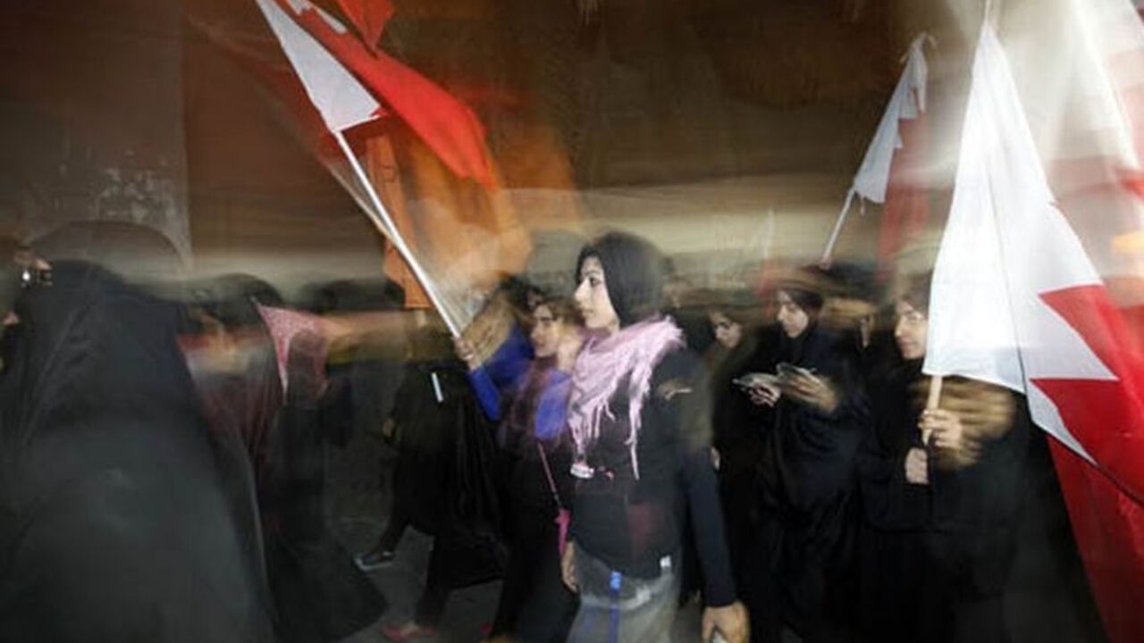 BAHRAIN-PROTEST/ Zainab al-Khawaja (C), daughter of human rights activist Abdulhadi al-Khawaja, takes part in a rally held in support of her father in the village of Bani-Jamra, west of Manama March 11, 2012. Supporters of human rights activist Abdulhadi al-Khawaja came out onto the streets in various villages in Bahrain asking for his release. Al-Khawaja is on his 32nd day of a hunger strike in prison, after being convicted by Bahrain's military court. REUTERS/Hamad I Mohammed (BAHRAIN - Tags: CIVIL UNREST POLITICS)