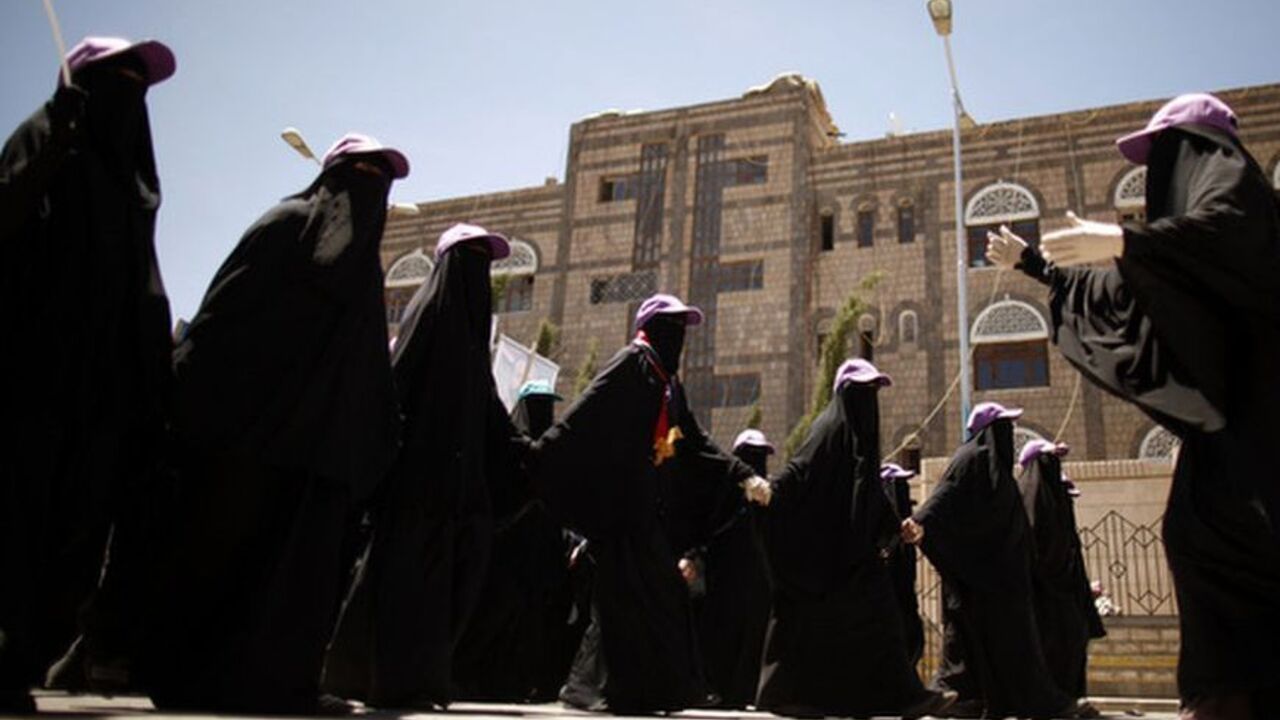 Protest leader gives directions to fellow protesters as they march during a demonstration in Sanaa A protest leader gives directions to fellow protesters as they march during a demonstration to demand that relatives of Yemen's former president Ali Abdullah Saleh be dismissed from senior army and police posts, in Sanaa May 10, 2012. REUTERS/Khaled Abdullah (YEMEN - Tags: POLITICS CIVIL UNREST)