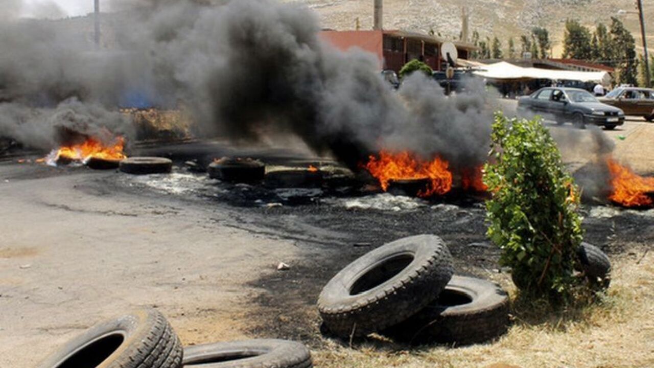 Tyres set ablaze by residents to protest against the kidnap of a hardline Sunni Lebanese supporter of the Syrian revolt against President Bashar al-Assad by Lebanese Alawites, block the main entrance of the northern Lebanese village of Wadi Khaled Tyres set ablaze by residents to protest against the kidnap of a hardline Sunni Lebanese supporter of the Syrian revolt against President Bashar al-Assad by Lebanese Alawites, block the main entrance of the northern Lebanese village of Wadi Khaled June 11, 2012, At least seven Lebanese and Syrian citizens have been kidnapped in northern Lebanon near the border with Syria, the first such reported abductions fuelled by tensions over the uprising in Syria that have spilled into its small neighbour. REUTERS/Ro