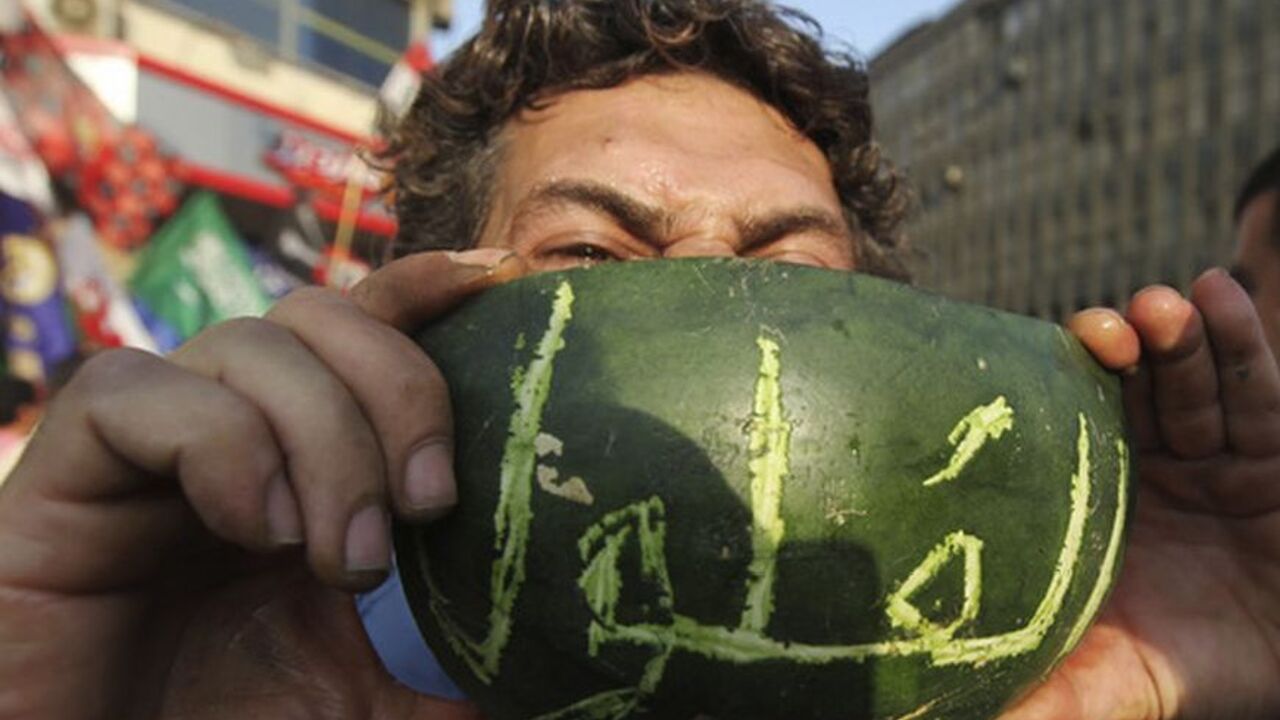 A man holds a water melon written with the word "feloul" in Cairo A man eats water melon carved with the word "Feloul", as supporters of the Muslim Brotherhood's presidential candidate Mohamed Morsy celebrate and shout anti military counciel at Tahrir square in Cairo June 19, 2012. Egypt's Muslim Brotherhood declared on Tuesday it did not want a confrontation with the ruling generals but said the army did not have the right to curb presidential powers after a vote the group says its candidate won. "Feloul" is a pejorative Egyptian political slang used to refer to "remnant