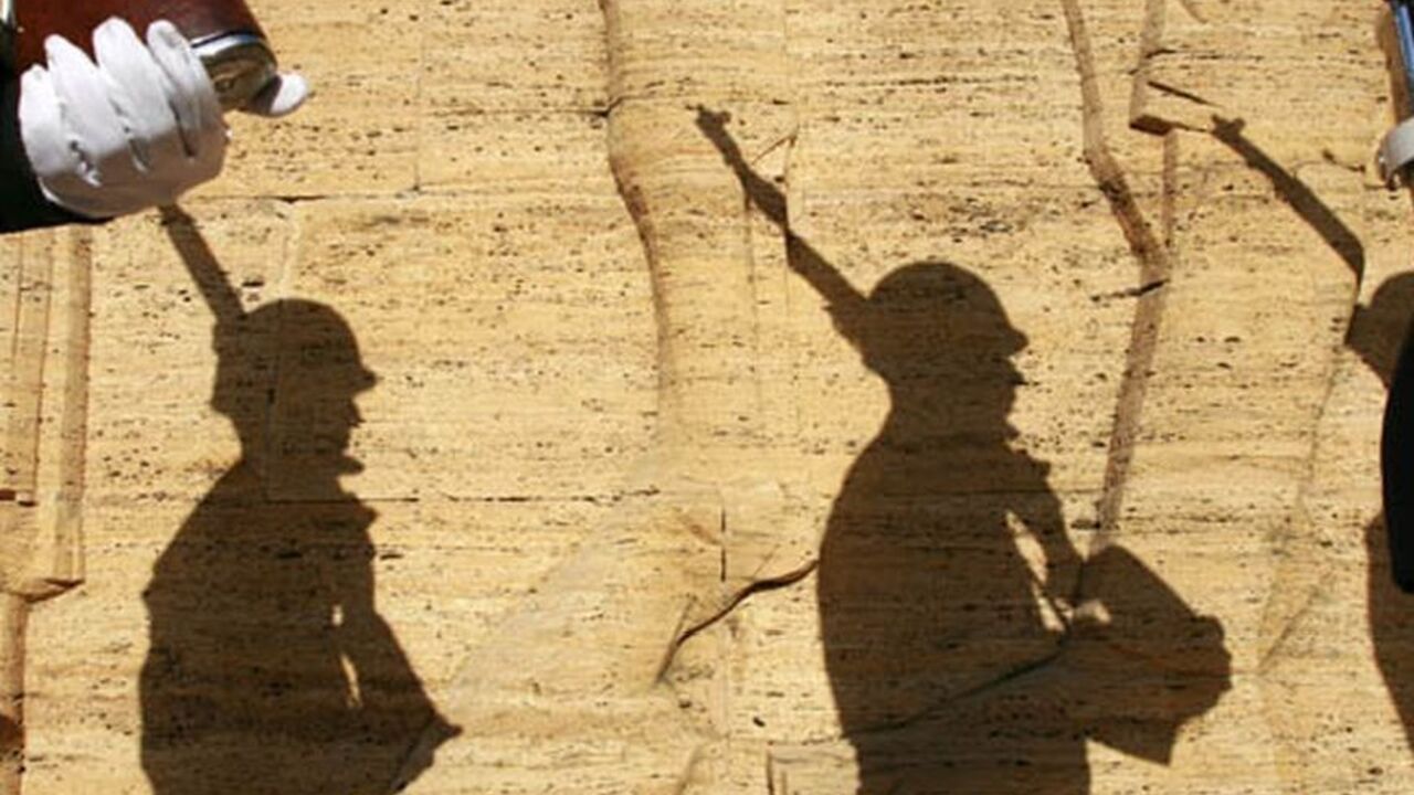 TURKEY-ATATURK/ Shadows of Turkish soldiers are seen on a wall as they wait for the start of a ceremony at the mausoleum of Mustafa Kemal Ataturk during the 70th anniversary of his death in Ankara November 10, 2008. A new film that portrays Turkey's revered founder Ataturk as a lonely, hard-drinking man beset by doubts has whipped up emotions in a country still grappling with his legacy 70 years after his death. Ataturk, a former soldier, founded modern Turkey as a secularist republic from the ashes of the Ottoman Empire.