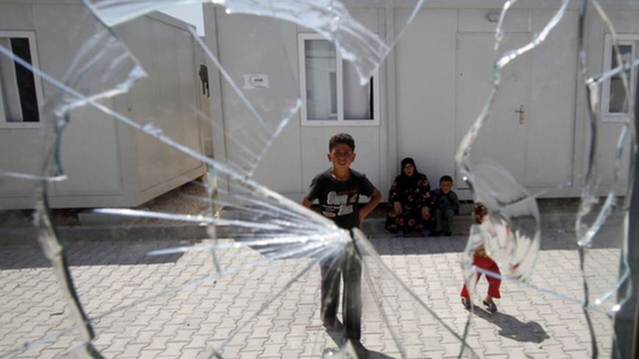 A window, broken by a stray bullet from clashes between the Syrian army and the rebels on Monday, is seen at a refugee camp named "Container City" in the province of Kilis A window, broken by a stray bullet from clashes between the Syrian army and the rebels on Monday, is seen at a refugee camp named "Container City" in the province of Kilis April 13, 2012. Most of the refugees in Turkey are located in the provinces of Gaziantep and Hatay. Authorities have also erected a container city in the province of Kilis where 9,000 people are staying. So many refugees have fled the violence in Syria that Turkey has begun accepting international aid to help share the cost of the caring