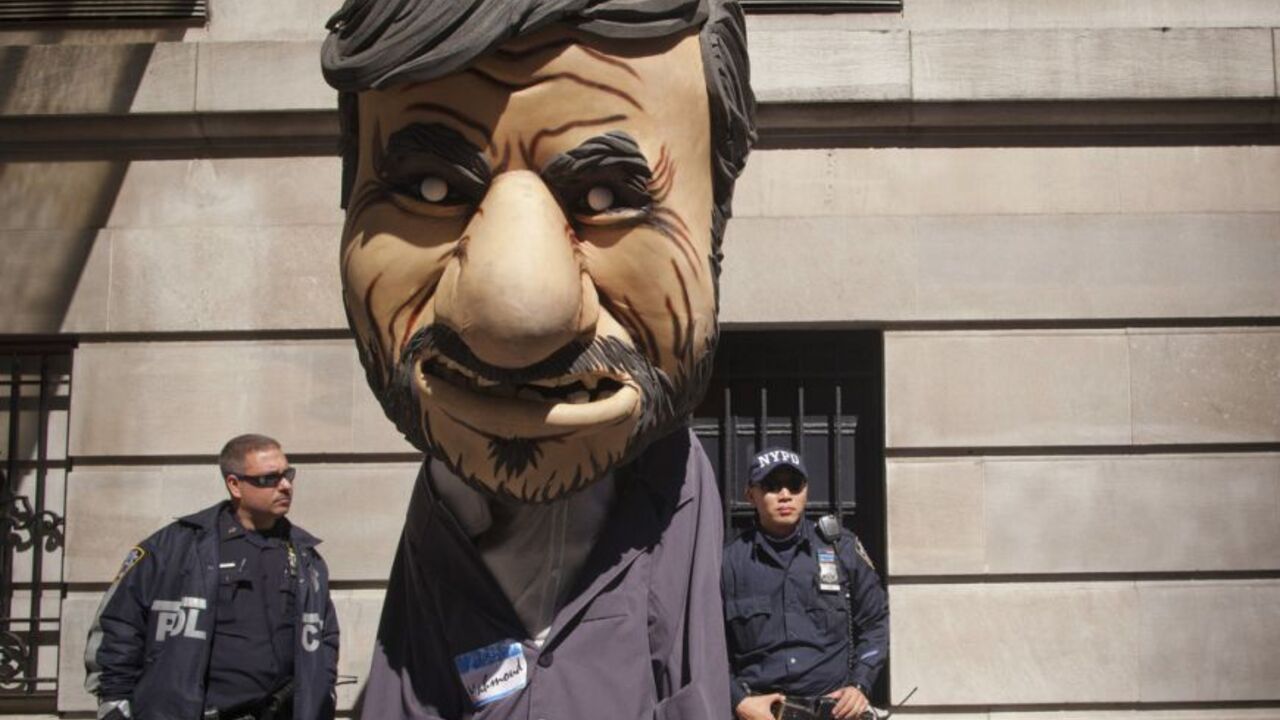 New York police officers look at a man dressed as Iranian President Ahmadinejad during a protest outside the Warwick Hotel in New York New York police officers look at a man dressed as Iranian President Mahmoud Ahmadinejad during a protest against Ahmadinejad outside the Warwick Hotel in New York September 25, 2012. Ahmadinejad is staying at the hotel during his visit to New York for the United Nations General Assembly. REUTERS/Andrew Kelly (UNITED STATES - Tags: POLITICS CIVIL UNREST)