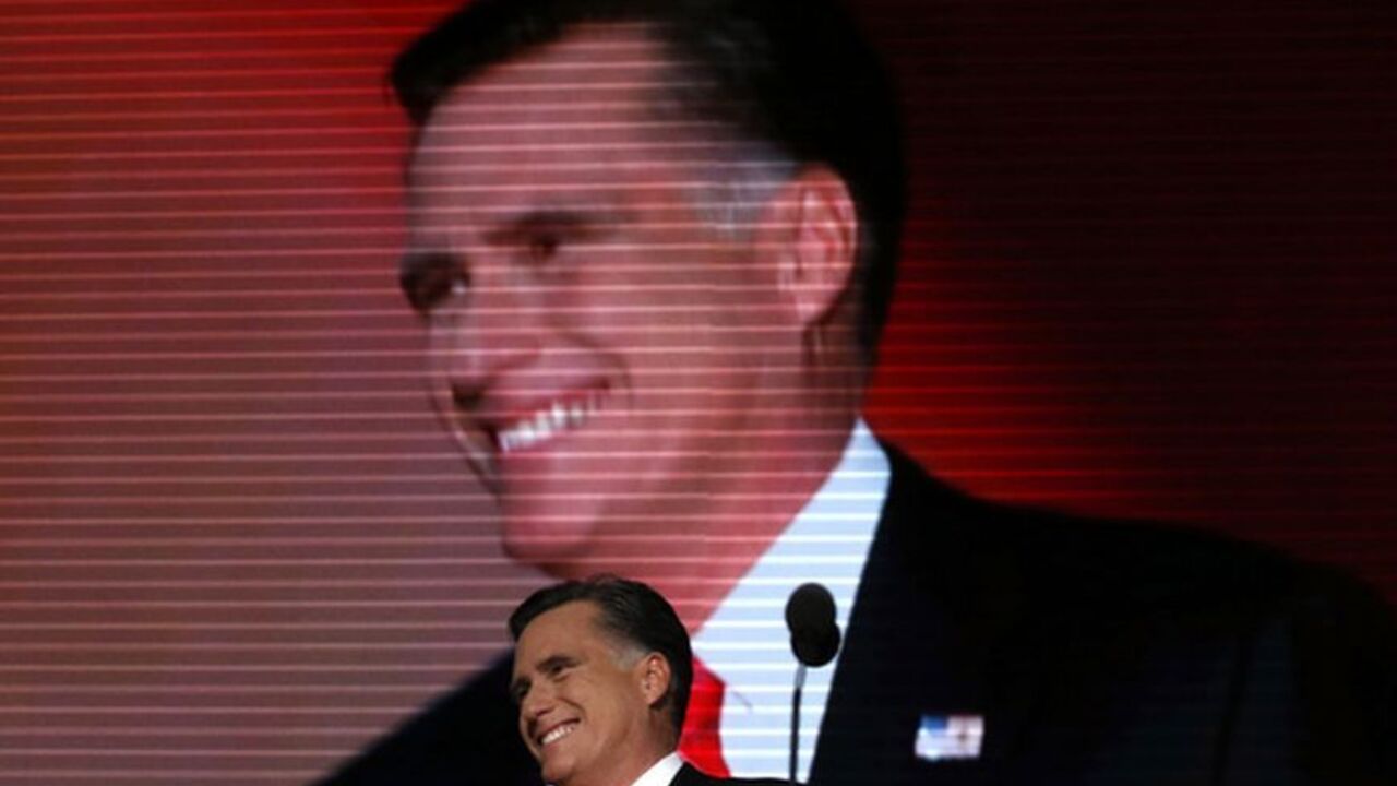 Republican presidential nominee Mitt Romney smiles as he arrives onstage to accept the nomination during the final session of the Republican National Convention in Tampa Republican presidential nominee Mitt Romney smiles as he arrives onstage to accept the nomination during the final session of the Republican National Convention in Tampa, Florida, August 30, 2012. REUTERS/Adrees Latif (UNITED STATES - Tags: ELECTIONS POLITICS)