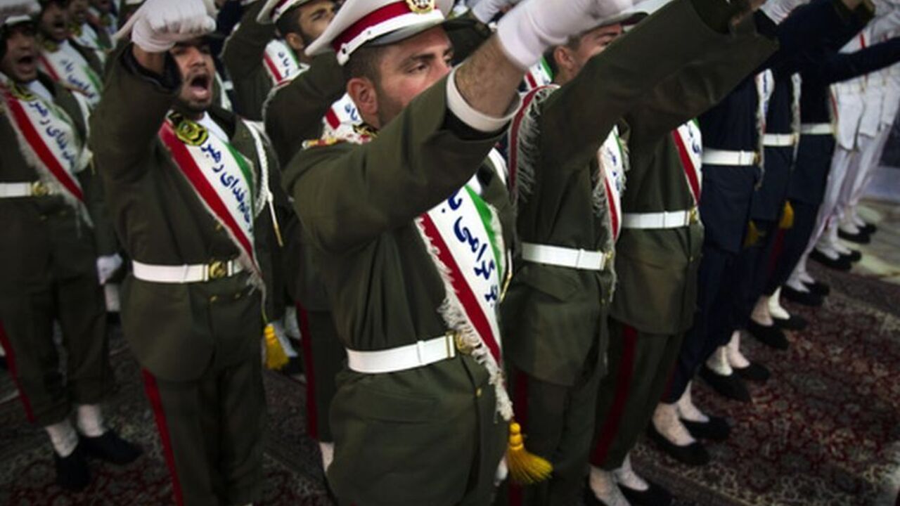 Iranian soldiers shout anti-U.S. slogans during the anniversary ceremony of Iran's Islamic Revolution at the Khomeini shrine in the Behesht Zahra cemetery EDITORS' NOTE: Reuters and other foreign media are subject to Iranian restrictions on leaving the office to report, film or take pictures in Tehran.
Iranian soldiers shout anti-U.S. slogans during the anniversary ceremony of Iran's Islamic Revolution at the Khomeini shrine in the Behesht Zahra cemetery, south of Tehran, February 1, 2012. REUTERS/Raheb Homavandi (IRAN - Tags: POLITICS MILITARY ANNIVERSARY)