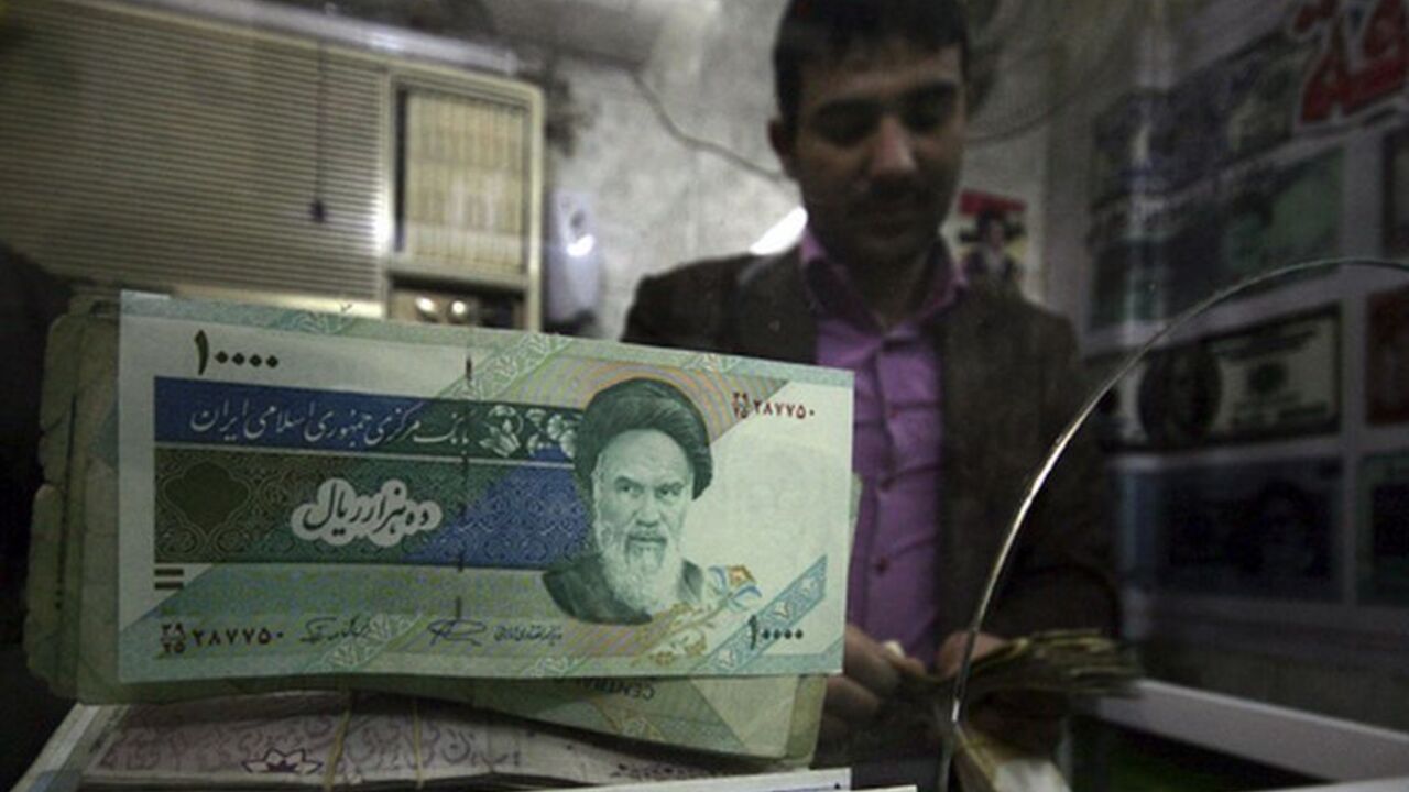 To match Feature IRAQ-SANCTIONS/ Iranian rial banknotes are seen at a currency exchange shop in Kerbala, 110 km (70 miles) south of Baghdad January 27, 2012. In the money changing shops dotted around Baghdad's Karrada district, Iraqi merchants dabble in many currencies, but these days some joke that banknotes from neighbouring Iran and Syria are only worth plastering on windows as decorations. Picture taken January 27, 2012. To match Feature IRAQ-SANCTIONS/ REUTERS/Mushtaq Muhammed (IRAQ - Tags: SOCIETY BUSINESS)