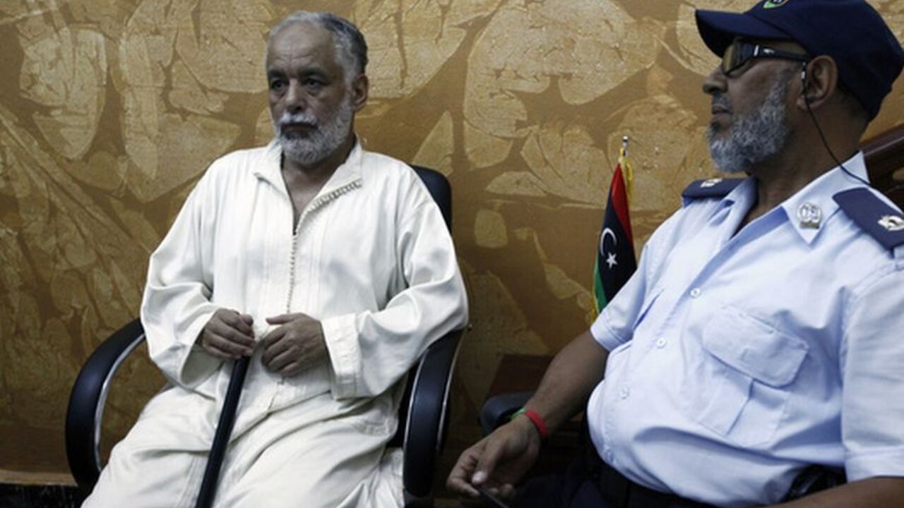 Deposed Libyan leader Muammar Gaddafi's former prime minister Al Baghdadi al-Mahmoudi sits in the office of his prison guard in Tripoli after being extradited from Tunis Deposed Libyan leader Muammar Gaddafi's former prime minister Al Baghdadi al-Mahmoudi sits in the office of his prison guard in Tripoli after being extradited from Tunis June 24, 2012. Members of Libya's judicial police and the national army's chief of staff travelled to Tunis to bring Mamhoudi back to Libya. REUTERS/Anis Mili (LIBYA - Tags: POLITICS CIVIL UNREST)