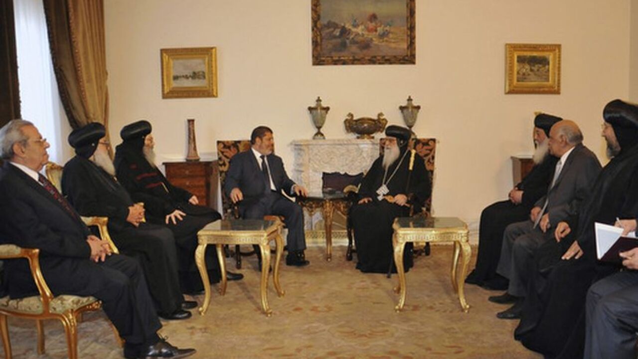 Muslim Brotherhood's President-elect Mohamed Mursi meets with a Christian delegation headed by the caretaker pope of the country's Coptic Church, Bishop Bakhomious at the presidential palace in Cairo The Muslim Brotherhood's President-elect Mohamed Mursi meets with a Christian delegation headed by the caretaker pope of the country's Coptic Church, Bishop Bakhomious (C), at the presidential palace in Cairo June 26, 2012. REUTERS/Middle East News Agency (MENA)/Handout (EGYPT - Tags: POLITICS ELECTIONS RELIGION) FOR EDITORIAL USE ONLY. NOT FOR SALE FOR MARKETING OR ADVERTISING CAMPAIGNS. THIS IMAGE HAS BEEN SUPPLIED BY A THIRD PARTY. IT IS DISTRIBUTED, EXACTLY AS RECEIVED BY REUTERS, AS A SERVICE TO CLIENT