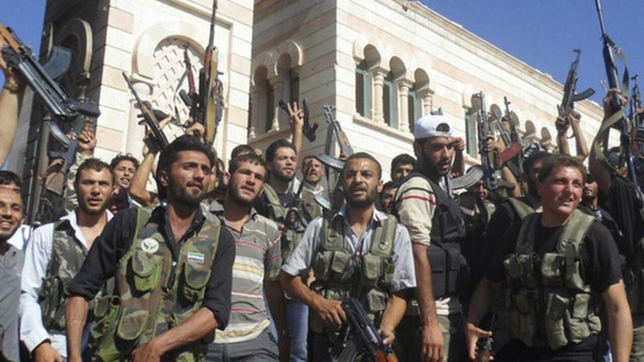 Members of the Free Syrian Army are seen in Azzaz, Aleppo province Members of the Free Syrian Army are seen in Azzaz, Aleppo province July 19, 2012. REUTERS/Shaam News Network/Handout (SYRIA - Tags: POLITICS CIVIL UNREST) FOR EDITORIAL USE ONLY. NOT FOR SALE FOR MARKETING OR ADVERTISING CAMPAIGNS. THIS IMAGE HAS BEEN SUPPLIED BY A THIRD PARTY. IT IS DISTRIBUTED, EXACTLY AS RECEIVED BY REUTERS, AS A SERVICE TO CLIENTS