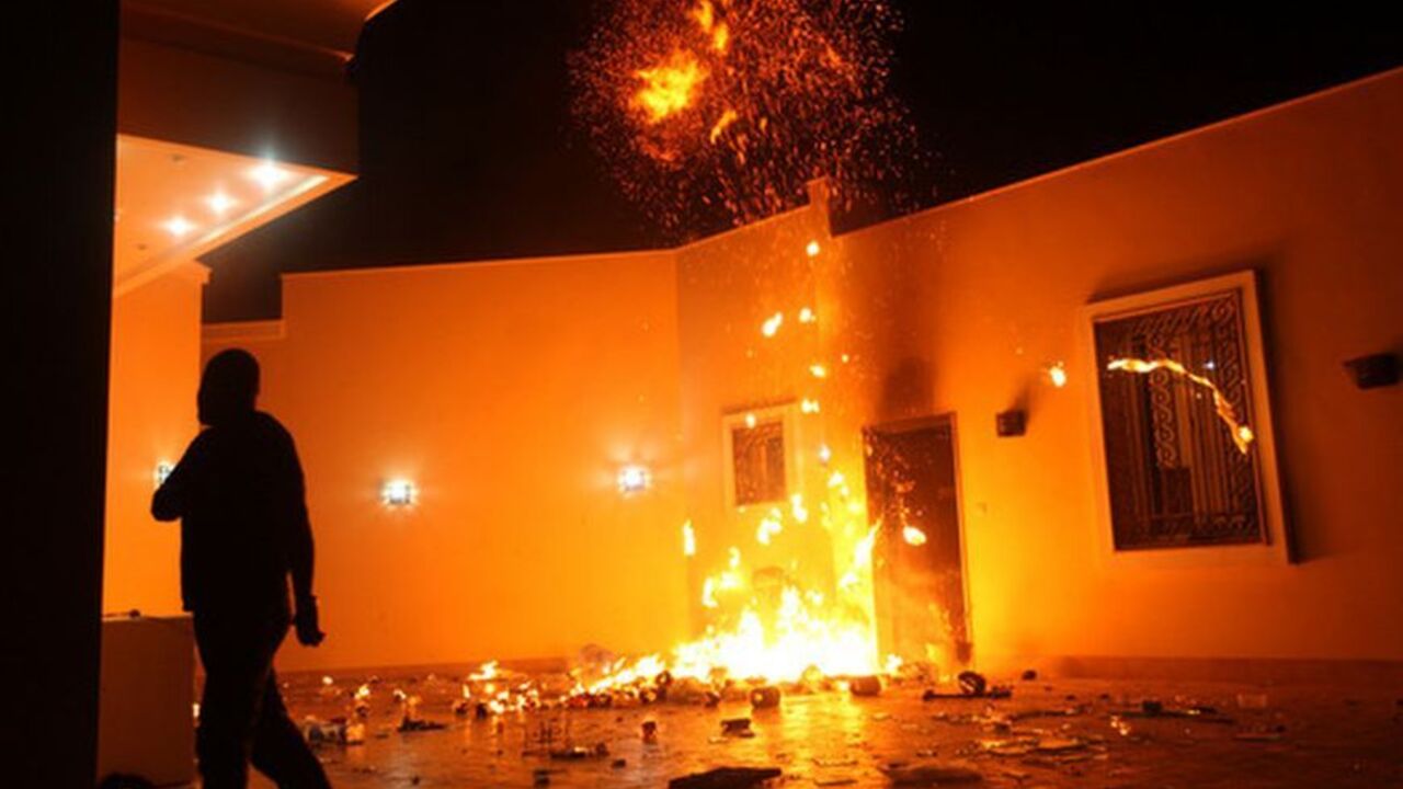 The U.S. Consulate in Benghazi is seen in flames during a protest The U.S. Consulate in Benghazi is seen in flames during a protest by an armed group said to have been protesting a film being produced in the United States September 11, 2012. An American staff member of the U.S. consulate in the eastern Libyan city of Benghazi has died following fierce clashes at the compound, Libyan security sources said on Wednesday. Armed gunmen attacked the compound on Tuesday evening, clashing with Libyan security forces before the latter withdrew as they came under heavy fire. REUTER