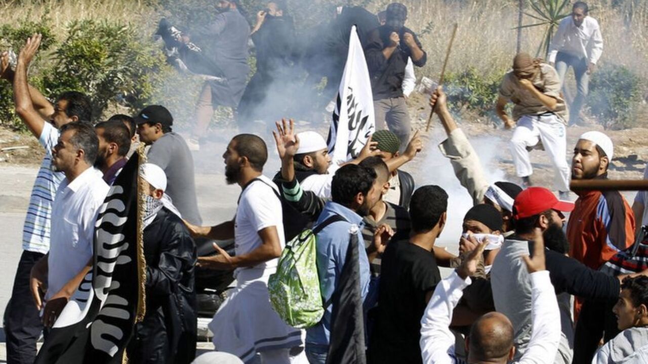 Protesters run for cover during a demonstration in front of the U.S. Embassy in Tunis Protesters run for cover during a demonstration in front of the U.S. Embassy in Tunis September 14, 2012. At least five protesters were wounded when Tunisian police opened fire on Friday to quell an assault on the U.S. embassy compound in the capital Tunis, a Reuters reporter said. It was not immediately clear if police fired live rounds or rubber bullets. A large fire erupted inside the compound which has been invaded by hundreds of people incensed by a U.S.-made film that demeans the Prophet Mohammad. REU