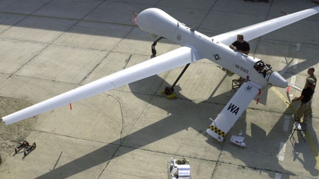 To match Special Report USA-PAKISTAN/DRONES Members of the 11th Reconnaissance Squadron from Indian Springs, Nev., perform pre-flight checks on the Predator unmanned aerial vehicle prior to a mission, in this November 9, 2001 file photo shot at an undisclosed location. In the rugged mountains of western Pakistan, missiles launched by unmanned Predator or Reaper drones have become so commonplace that some U.S counterterrorism officials liken them to "cannon fire." To match Special Report USA-PAKISTAN-DRONES REUTERS/U.S. Air Force/Handout/Files (U