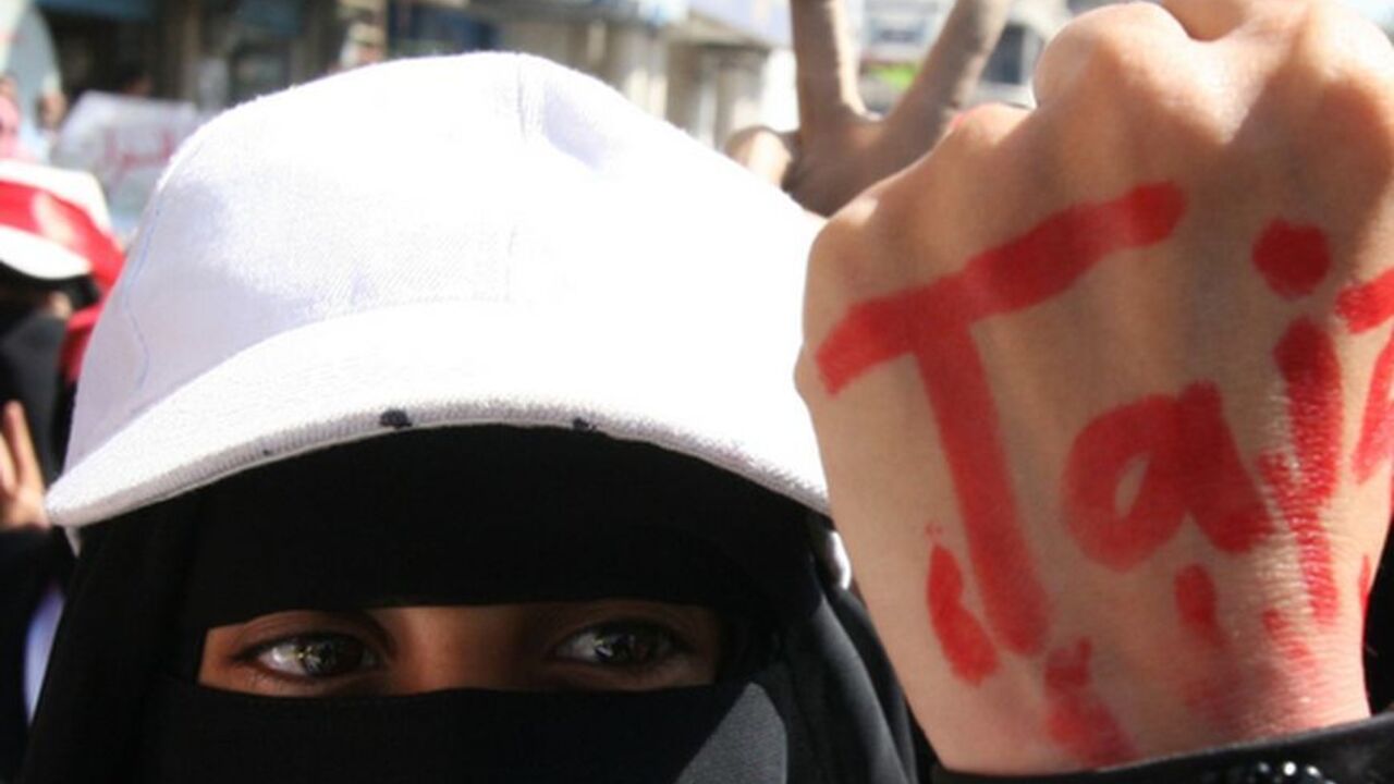 Nic6035764 A Yemeni women wears a lock around her wrist with the name Taiz painted in red on her hand, during a demonstration in Taiz, south of the capital Sanaa on December 5, 2011. Forces loyal to Yemeni President Ali Abdullah Saleh shot dead a woman and wounded six other people when they opened fire on a crowd of protesters, medics said.
AFP PHOTO/STR (Photo credit should read -/AFP/Getty Images)