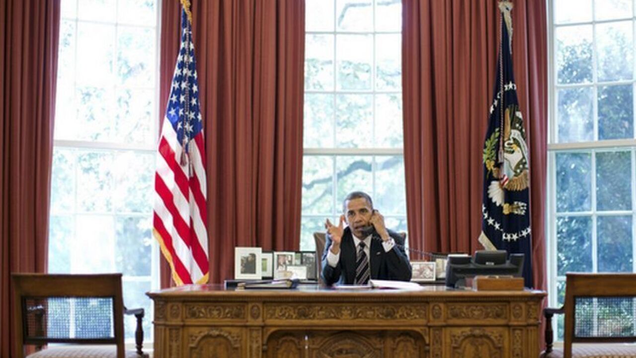 U.S. President Obama speaks on the phone with Israeli Prime Minister Netanyahu at the White House in Washington U.S. President Barack Obama speaks on the phone with Israel's Prime Minister Benjamin Netanyahu, in the Oval Office in this September 28, 2012 White House handout photograph. Obama and Netanyahu expressed solidarity on the goal of preventing Iran from acquiring a nuclear weapon, the White House said on Friday, amid signs of easing tensions over their differences on how to confront Tehran. REUTERS/Pete Souza/The White House/Handout (UNITED STATES - Tags: POLITICS TPX IMAGES OF THE DAY) FOR EDITORIAL USE ONL