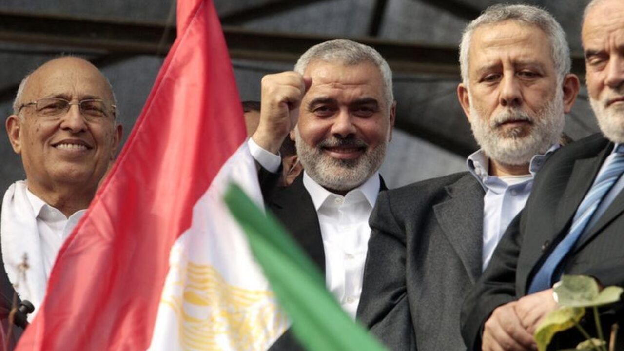 Senior Hamas leader Ismail Haniyeh and Islamic Jihad leader Mohammed Al-Hindi , senior Fatah official Nabil Shaath and deputy speaker of Palestinian Parliament Ahmed Bahar celebrate during a rally in Gaza City Senior Hamas leader Ismail Haniyeh (2nd L) and Islamic Jihad leader Mohammed Al-Hindi (2nd R), senior Fatah official Nabil Shaath (L) and deputy speaker of Palestinian Parliament Ahmed Bahar celebrate what Palestinians say is a victory over Israel after an eight-day conflict, during a rally in Gaza City November 22, 2012. A ceasefire between Israel and Gaza's Hamas rulers took hold on Thursday after eight days of conflict, although deep mistrust on both sides cast doubt on how long the Egyptian-sponsored de
