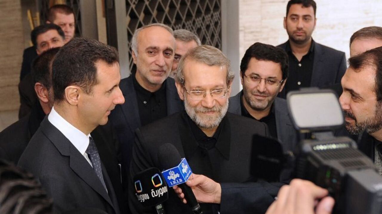 Syria's President Bashar al-Assad and Iran's Parliament speaker Ali Larijani speak to the media after meeting in Damascus Syria's President Bashar al-Assad (L) and Iran's Parliament speaker Ali Larijani (C) speak to the media after meeting in Damascus November 23, 2012, in this handout photograph released by Syria's national news agency (SANA). REUTERS/SANA/Handout (SYRIA - Tags: POLITICS) FOR EDITORIAL USE ONLY. NOT FOR SALE FOR MARKETING OR ADVERTISING CAMPAIGNS. THIS IMAGE HAS BEEN SUPPLIED BY A THIRD PARTY. IT IS DISTRIBUTED, EXACTLY AS RECEIVED BY REUTERS, AS A SERVICE TO CLIENTS