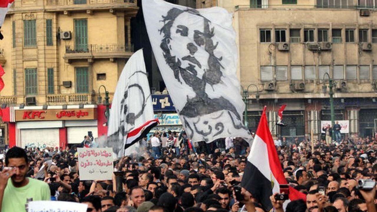Thousands of protesters carried banners emblazoned with photos of the January 2011 uprising victims and protested President Mohamed Morsi's constitutional declaration granting him sweeping powers. Friday Nov. 23.