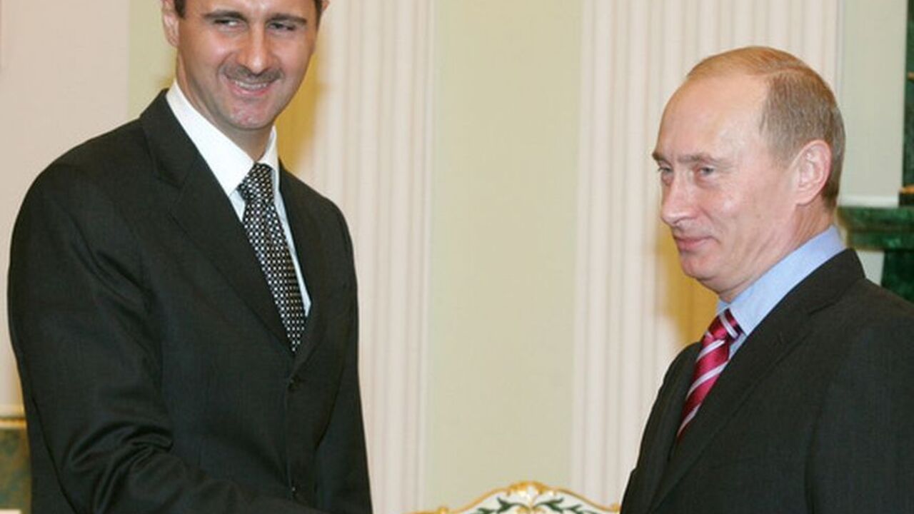Russia's President Putin and Syrian President Bashar al-Assad shake hands as they meet in Moscow Russia's President Vladimir Putin (R) and Syrian President Bashar al-Assad shake hands as they meet in Moscow's Kremlin December 19, 2006. REUTERS/Sergei Karpukhin (RUSSIA)