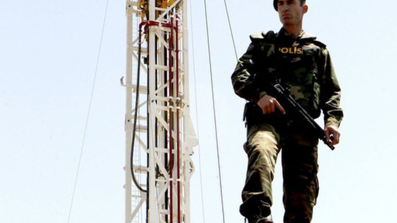 A Turkish police officer stands guard close to a drilling rig near Famagusta A Turkish police officer stands guard close to a drilling rig near Famagusta April 26, 2012. Turkey on Thursday began drilling for oil and gas in breakaway northern Cyprus, threatening to inflame tensions with Greek Cypriots and undermine UN-backed efforts to reunite the divided island, key to Ankara's aspirations to join the European Union. At a ceremony in northeast Cyprus, the state-run Turkish Petroleum Corporation (TPAO) launched onshore drilling at the 3,000-metre-deep Turkyurdu-1 well in search of hy