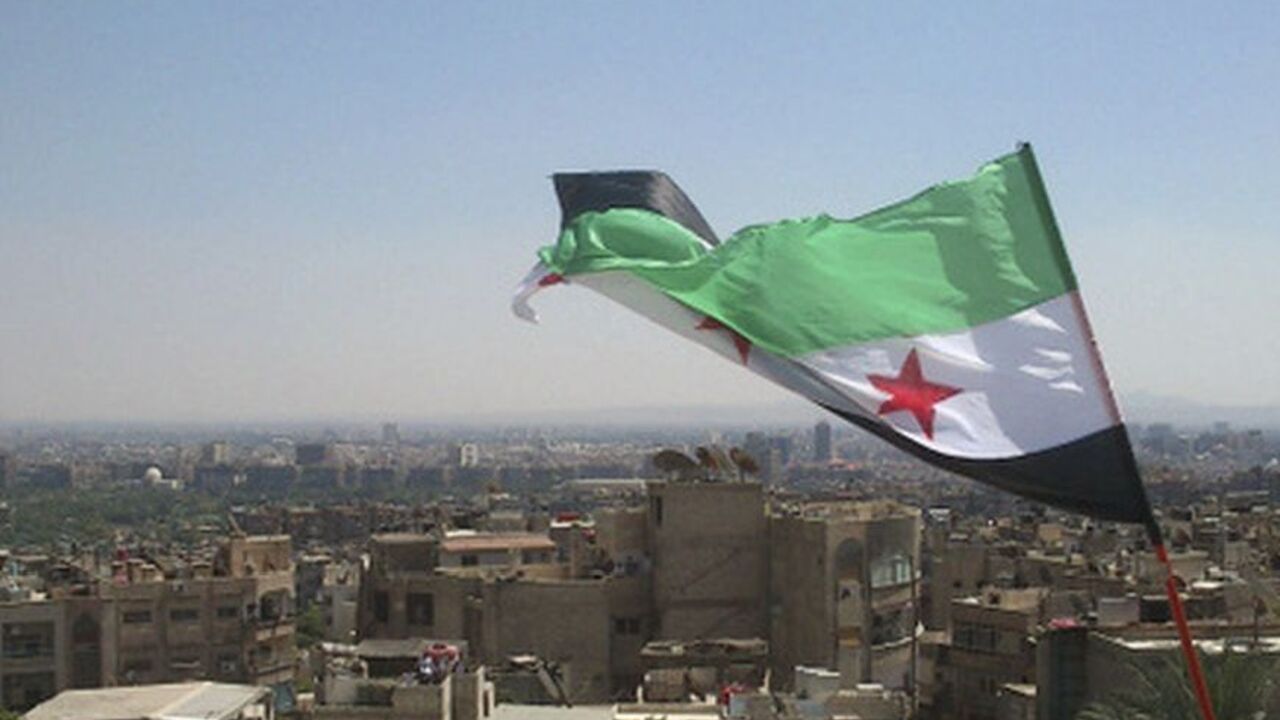 An opposition flag is seen over neighborhood Ruknuddin in Damascus An opposition flag is seen over neighborhood Ruknuddin in Damascus August 5, 2012. Picture taken August 5, 2012. REUTERS/Shaam News Network/Handout (SYRIA - Tags: POLITICS CIVIL UNREST) FOR EDITORIAL USE ONLY. NOT FOR SALE FOR MARKETING OR ADVERTISING CAMPAIGNS. THIS IMAGE HAS BEEN SUPPLIED BY A THIRD PARTY. IT IS DISTRIBUTED, EXACTLY AS RECEIVED BY REUTERS, AS A SERVICE TO CLIENTS