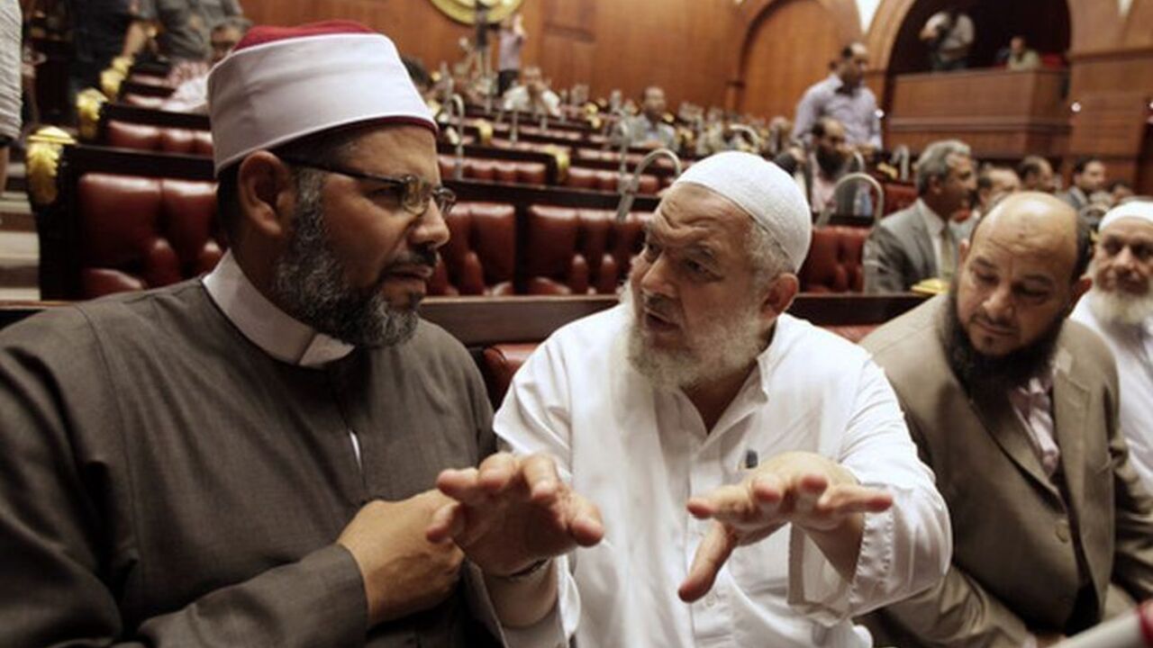 Abd Elrahman Elbar and Saeed Abd Elazeem, members of committee drafting new constitution, speak at the Shura Council in Cairo Abd Elrahman Elbar (L) and Saeed Abd Elazeem (2nd L), members of the committee drafting Egypt's new constitution, speak at the Shura Council in Cairo September 11, 2012. REUTERS/Mohamed Abd El Ghany (EGYPT - Tags: POLITICS)