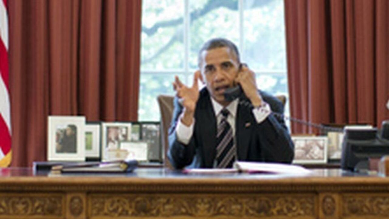 U.S. President Obama speaks on the phone with Israeli Prime Minister Netanyahu at the White House in Washington U.S. President Barack Obama speaks on the phone with Israel's Prime Minister Benjamin Netanyahu, in the Oval Office in this September 28, 2012 White House handout photograph. Obama and Netanyahu expressed solidarity on the goal of preventing Iran from acquiring a nuclear weapon, the White House said on Friday, amid signs of easing tensions over their differences on how to confront Tehran. REUTERS/Pete Souza/The White House/Handout (UNITED STATES - Tags: POLITICS TPX IMAGES OF THE DAY) FOR EDITORIAL USE ONL