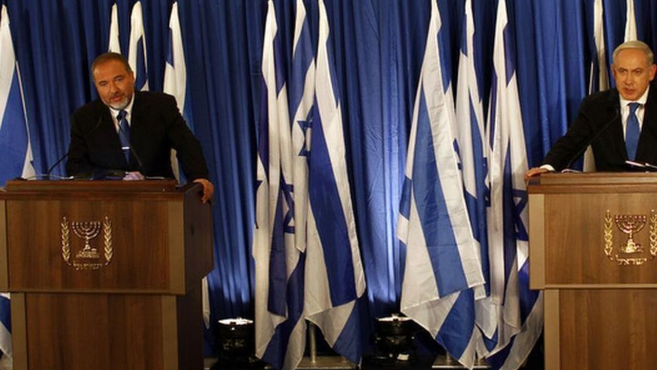 Benjamin Netanyahu and Avigdor Lieberman hold a joint news conference in Jerusalem Israel's Prime Minister Benjamin Netanyahu (R) and Foreign Minister Avigdor Lieberman hold a joint news conference in Jerusalem October 25, 2012. Netanyahu said on Thursday he was merging his Likud party with that of his ultra-nationalist coalition ally Lieberman in a hard-right tack ahead of Israel's Jan. 22 election.
REUTERS/Ammar Awad (JERUSALEM - Tags: POLITICS)