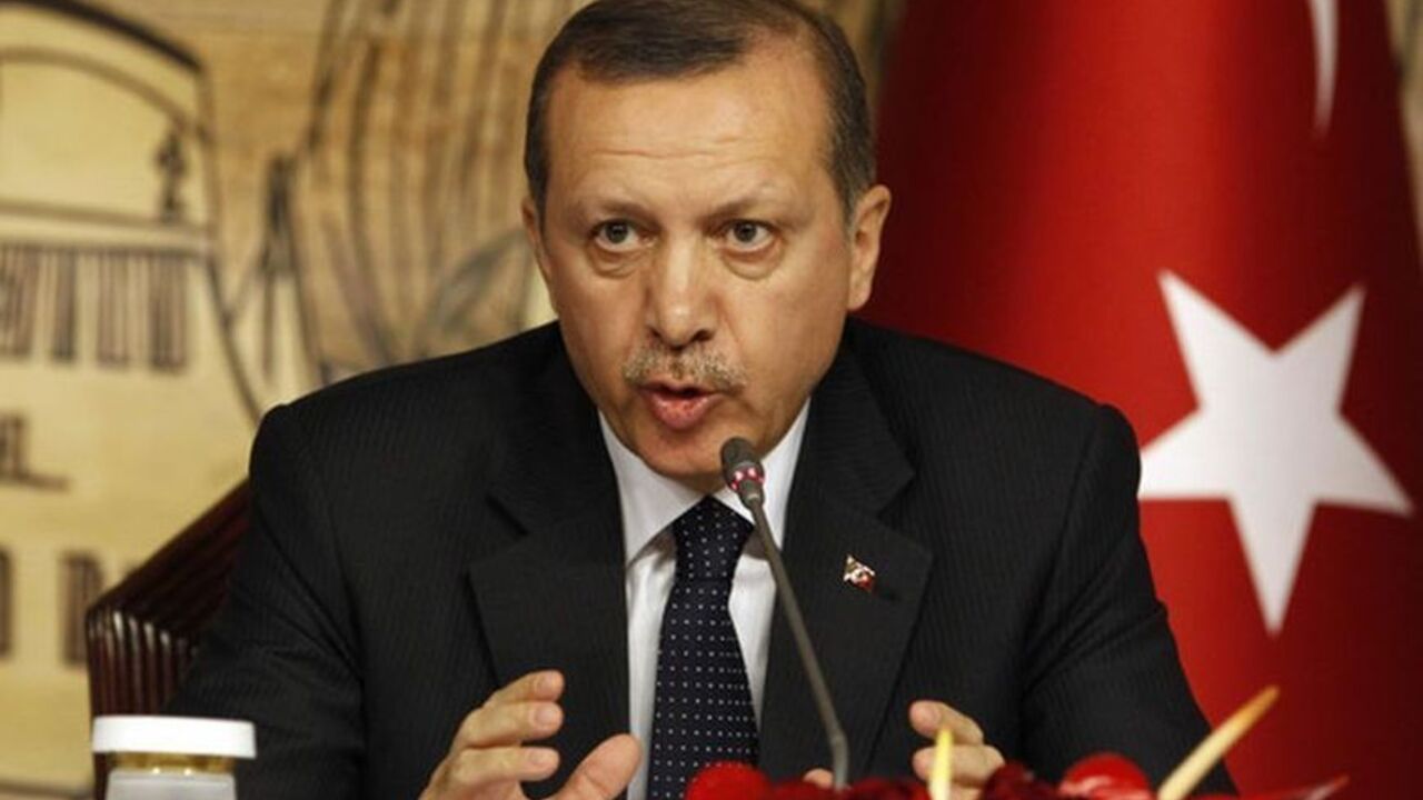 Prime Minister Erdogan gestures during a news conference after their meeting with Russia's President Putin Prime Minister Tayyip Erdogan gestures during a news conference after his meeting with Russia's President Vladimir Putin in Istanbul December 3, 2012. REUTERS/Osman Orsal (TURKEY - Tags: POLITICS)