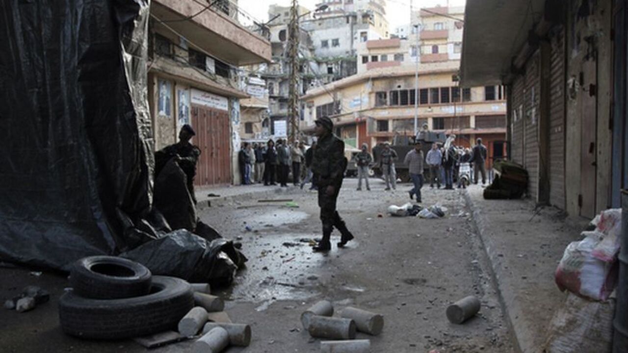 Lebanese army soldiers remove barricades to open a blocked street after days of clashes between Sunni Muslims and Alawites in the port-city of Tripoli Lebanese army soldiers remove barricades to open a blocked street after days of clashes between Sunni Muslims and Alawites in the port-city of Tripoli, northern Lebanon December 10, 2012. Tensions in northern Lebanon have been high since at least 14 Sunni Muslim Lebanese and Palestinian gunmen from the area were killed by Syrian security forces a week ago in a Syrian border town. The men appeared to have joined the armed insurgency against Syrian President Bashar al-Assad. REUTERS/Omar Ibrahim (LEBANON -