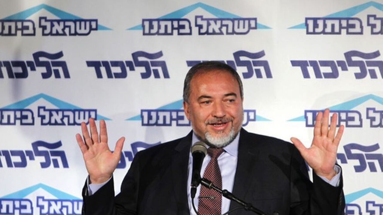 Israeli Foreign Minister Avigdor Lieberman gestures as he speaks at a conference for young members of his Yisrael Beiteinu party in Tel Aviv December 13, 2012. Lieberman said on Thursday he need not resign after the Justice Ministry decided to indict him for fraud and breach of trust, less severe charges than were originally considered. REUTERS/Amir Cohen (ISRAEL - Tags: POLITICS)