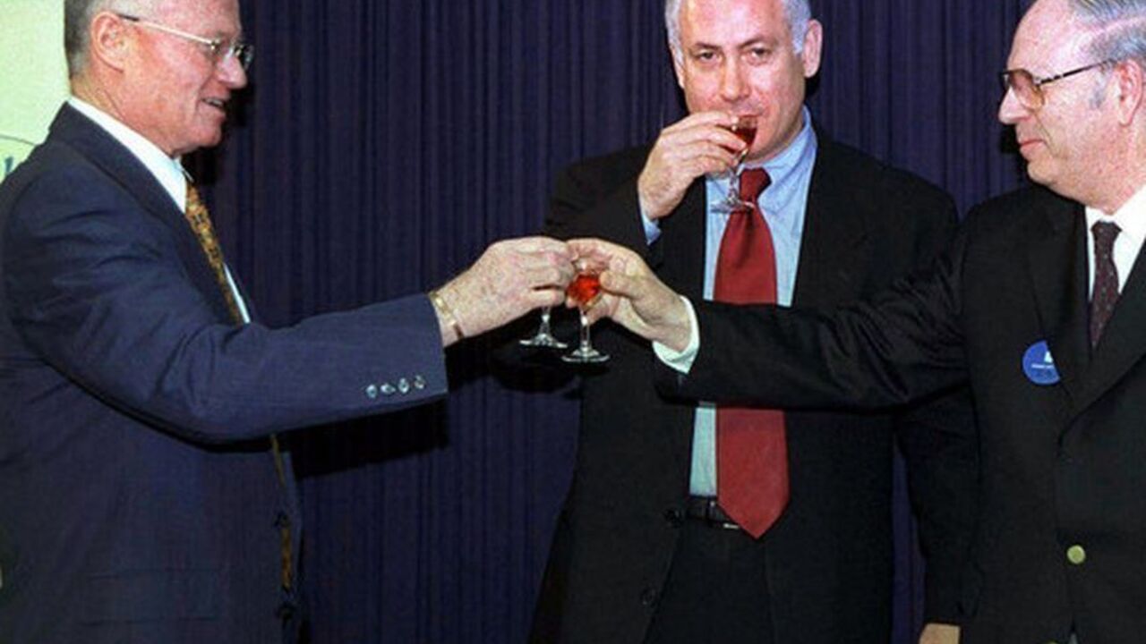 BENJAMIN NETANYAHU IN MOSSAD CEREMONY WITH EFRAIM HALEVY AND DANNY YATOM Prime Minister Benjamin Netanyahu (C) joins Efraim Halevy (R) who succeeds outgoing Mossad chief Danny Yatom (L) in a toast in the prime minister's offices during the Mossad handover ceremony April 8. Yatom resigned as Mossad spy chief in February amid scandals over botched missions in Jordan and Switzerland. Halevy, was born in 1934 in Britain and immigrated to Israel during the 1948 Arab-Israeli war that followed the creation of the State of Israel. He served as a former deputy Mossad chief and is expecte