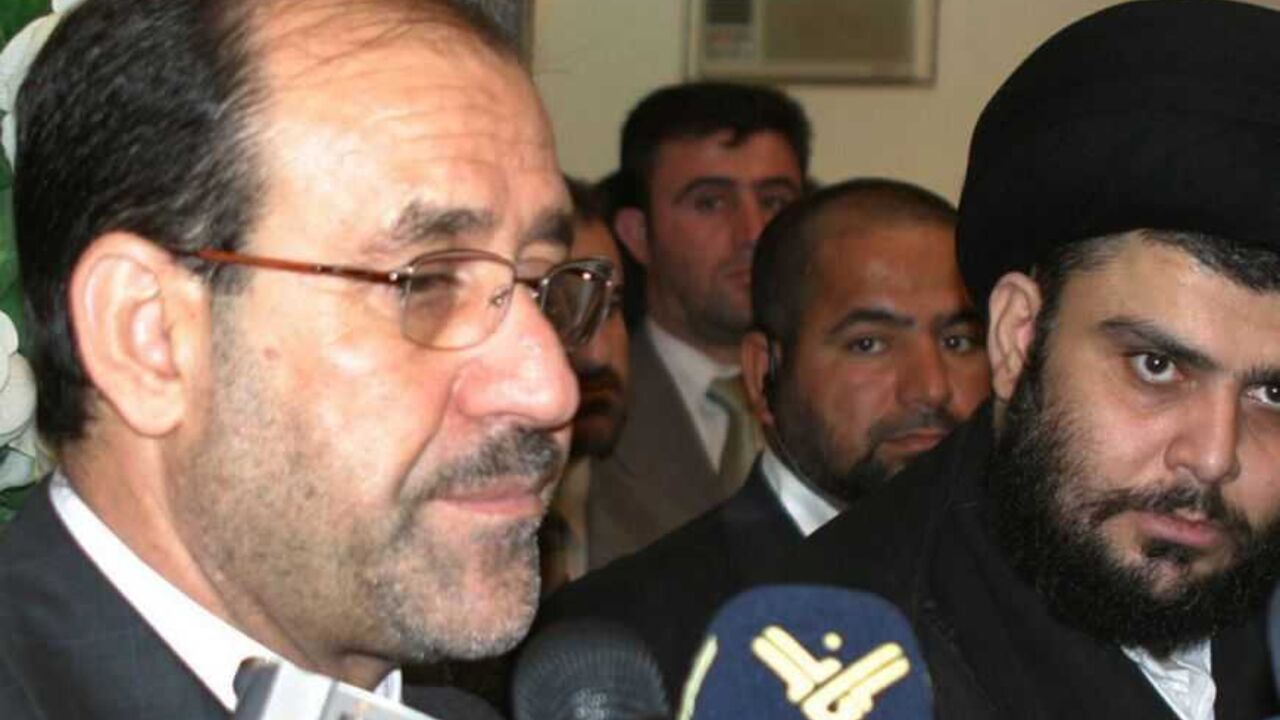 Iraqi Prime Minister al-Maliki stands next to Shi'ite cleric Moqtada al-Sadr during news conference in Najaf Iraq's Prime Minister Nuri al-Maliki (L) stands next to Shi'ite cleric Moqtada al-Sadr during a news conference in Najaf, 160 km (100 miles) south of Baghdad October 18, 2006. Maliki travelled to the holy city of Najaf on Wednesday and met Sadr and Grand Ayatollah Ali al-Sistani, the leading Shi'ite cleric in Iraq. REUTERS/AliAbu Shish (IRAQ)