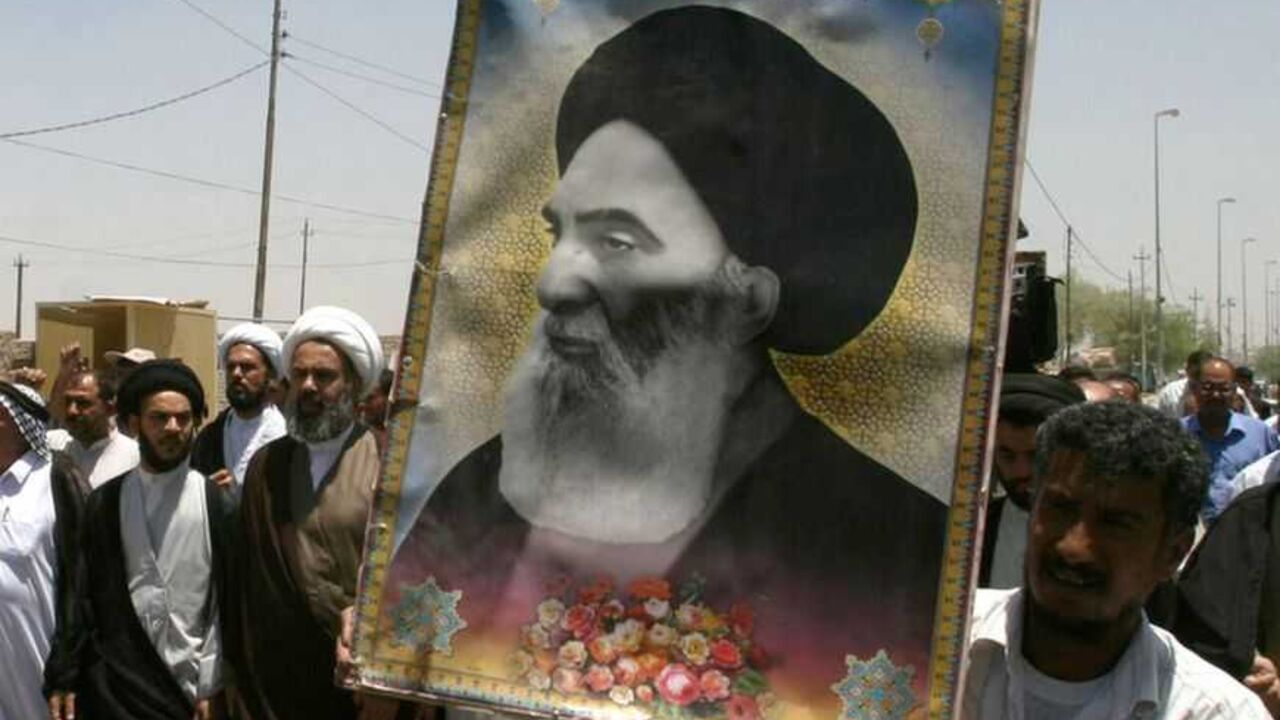Iraqis carry a poster of top Shi'ite cleric Grand Ayatollah Ali al-Sistani during a demonstration in Najaf Iraqis carry a poster of top Shi'ite cleric Grand Ayatollah Ali al-Sistani during a demonstration in Najaf, 160 km (100 miles) south of Baghdad June 13, 2007. Dozens of residents took to the streets in Najaf protesting the latest bomb attack in Samarra's Golden Mosque Shi'ite shrine. REUTERS/Ali Abu Shish (IRAQ)