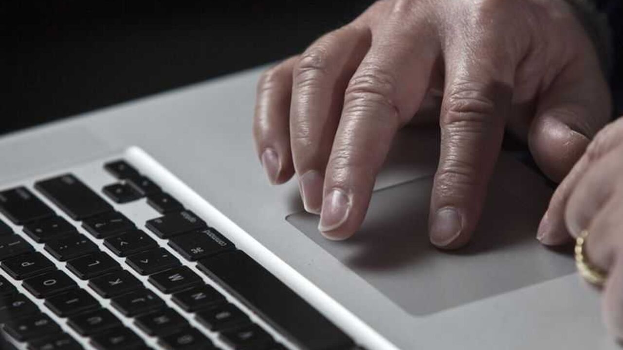 To match Insight - CYBERSECURITY/IRAN John Bumgarner, a cyber warfare expert who is chief technology officer of the U.S. Cyber Consequences Unit, a non-profit group that studies the impact of cyber threats, works on his laptop computer during a portrait session in Charlotte, North Carolina December 1, 2011. A cyber warfare expert claims he has linked the Stuxnet computer virus that attacked Iran's nuclear program in 2010 to Conficker, a mysterious worm that surfaced in late 2008 and infected millions of PCs. Conficker was used to open back door