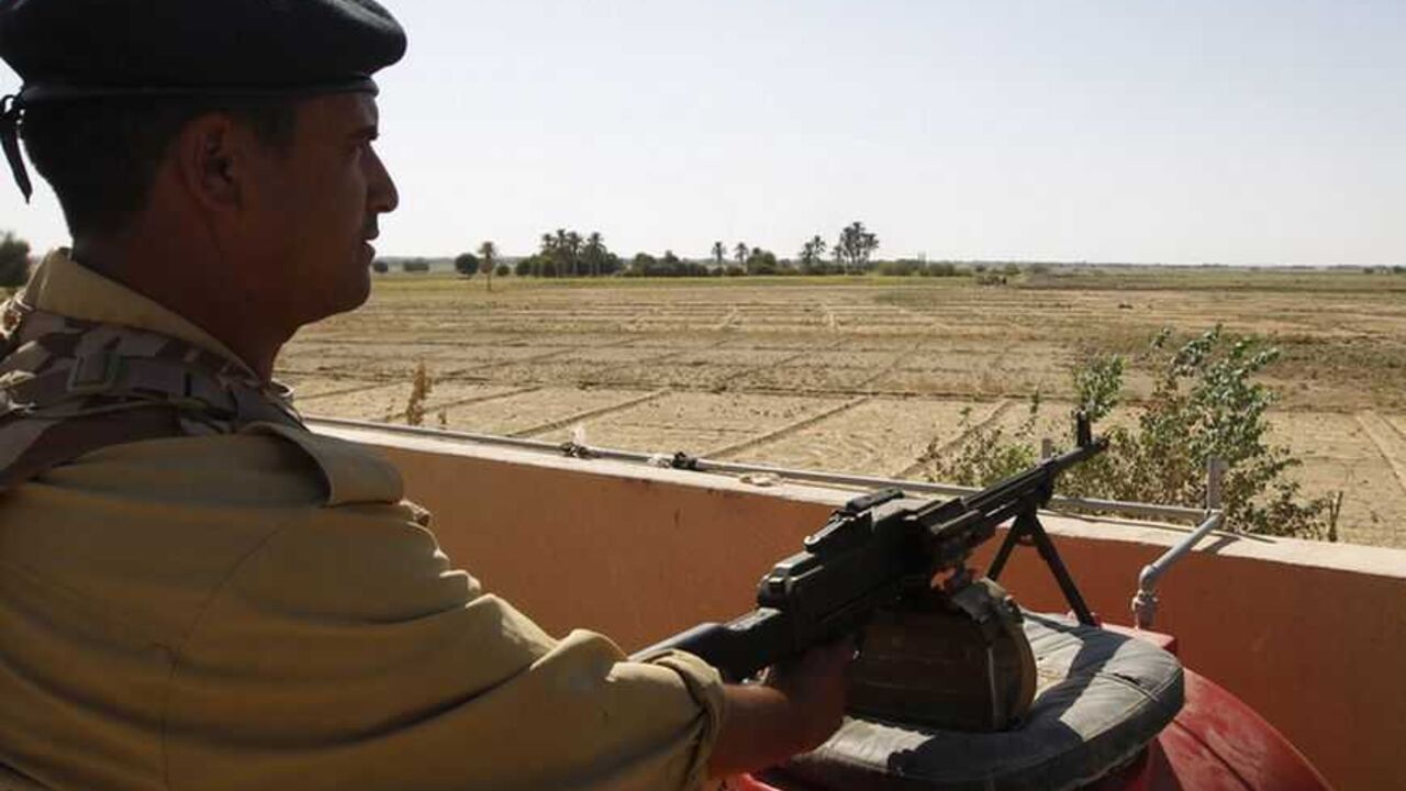 An Iraqi border policeman mans a machine gun near the Iraqi-Syrian borders at the Abu Kamal-qaim border crossing An Iraqi border policeman mans a machine gun near the Iraqi-Syrian borders at the Abu Kamal-qaim border crossing, the main border post between Iraq and Syria, September 8, 2012. Al Qaim, in the Sunni heartland of Anbar province, reflects the tricky balancing act Iraq's Shi'ite leaders face in Syria, whose crisis is testing the Middle East's sectarian divide. Al Qaim and its neighbouring Syrian counterpart Albu Kamal are on a strategic supply route for smugglers, gun-runners and now insurgents aiming to join