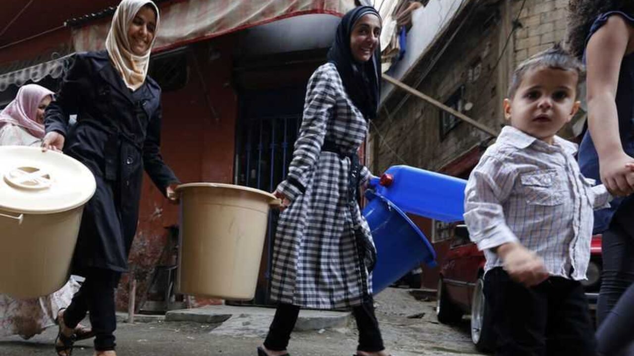 Syrian refugees carry tools donated by humanitarian activists on the first day of Eid al-Adha in Beirut Syrian refugees carry tools donated by humanitarian activists on the first day of Eid al-Adha in Beirut October 26, 2012. Muslims around the world celebrate Eid al-Adha, marking the end of the haj, by slaughtering sheep, goats, cows and camels to commemorate Prophet Abraham's willingness to sacrifice his son Ismail on God's command. REUTERS/Jamal Saidi (LEBANON - Tags: RELIGION SOCIETY)