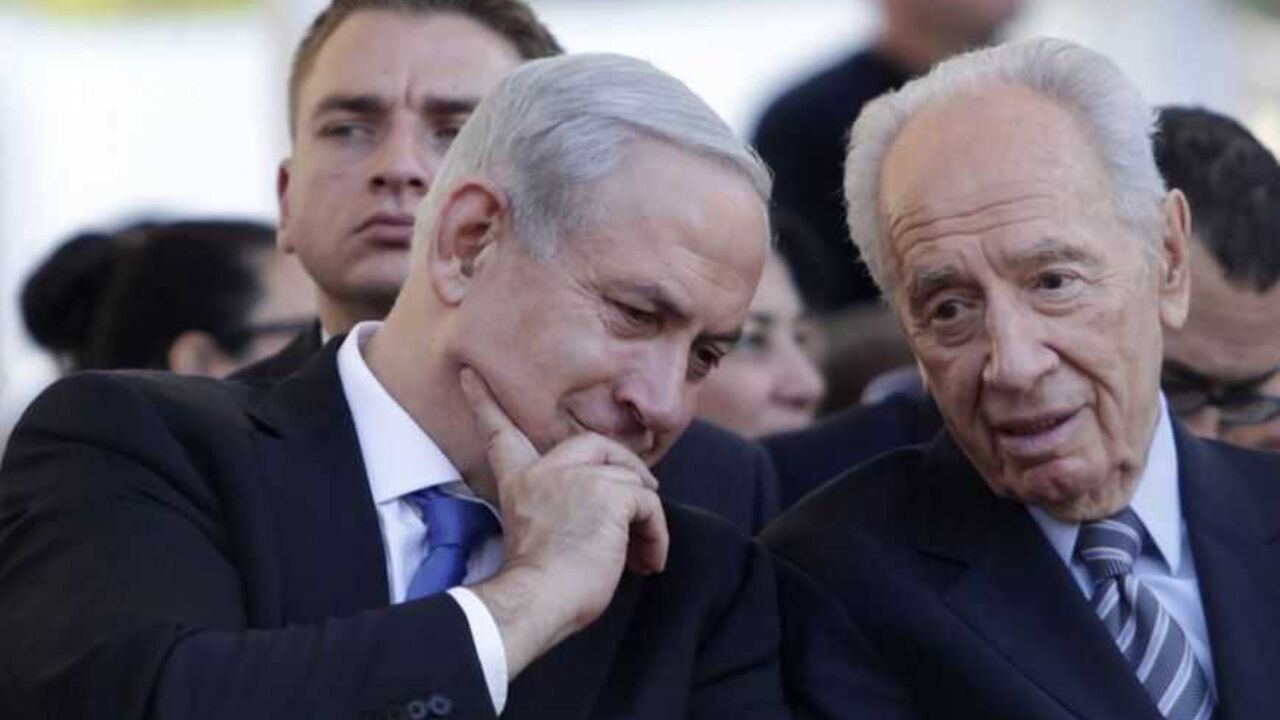 Israel's President Shimon Peres and Prime Minister Benjamin Netanyahu speak during the annual memorial ceremony for Israel's first prime minister, David Ben-Gurion, at Sde Boker Israel's President Shimon Peres (R) and Prime Minister Benjamin Netanyahu speak during the annual memorial ceremony for Israel's first prime minister, David Ben-Gurion, at Sde Boker in southern Israel November 20, 2012. Israel wants to find a long-term, diplomatic solution to resolve the Gaza crisis, but will not hesitate to escalate its military campaign against Palestinian militants if needed, Netanyahu said on Tuesday. REUTERS/Dan Balilty/Pool (ISRAEL - Tags: POLITICS CIVIL UNREST ANNIVERSARY)