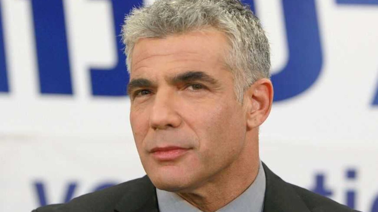 Yair Lapid, leader of the Yesh Atid party, pauses while addressing supporters in Tel Aviv Yair Lapid, leader of the Yesh Atid (There's a Future) party, pauses while addressing supporters at his party's headquarters in Tel Aviv January 23, 2013. Lapid, a former television news anchor whose new centrist party stormed to second place in Israel's election, may well be the kingmaker holding the keys to the next coalition government. REUTERS/Ammar Awad (ISRAEL - Tags: POLITICS ELECTIONS PROFILE HEADSHOT)