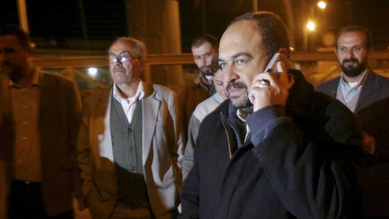 Palestinian Public Works and Housing Minister Zidan of Hamas speaks on his cell phone in the outskirts of the West Bank city of Jenin Palestinian Public Works and Housing Minister Abdel-Rahman Zidan (R) of Hamas speaks on his cell phone at a checkpoint on the outskirts of the West Bank city of Jenin November 29, 2006. Israeli authorities on Wednesday released one of the Hamas government ministers it detained after gunmen from the Gaza Strip abducted an Israeli soldier in June, witnesses said. REUTERS/Mohamad Torokman (WEST BANK)