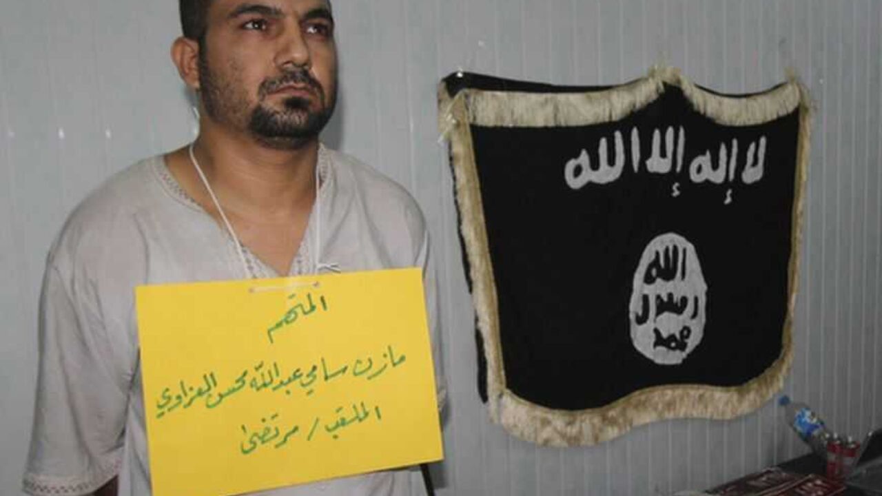 Police present a suspected al-Qaeda militant to the media in Kirkuk Police present a suspected al-Qaeda militant to the media in Kirkuk, 250 km (155 miles) north of Baghdad, October 7, 2012. Six suspected militants accused of bomb attacks and armed robbery were arrested after raid operations, police in Kirkuk said. REUTERS/Ako Rasheed (IRAQ - Tags : - Tags: CONFLICT CIVIL UNREST CRIME LAW POLITICS)