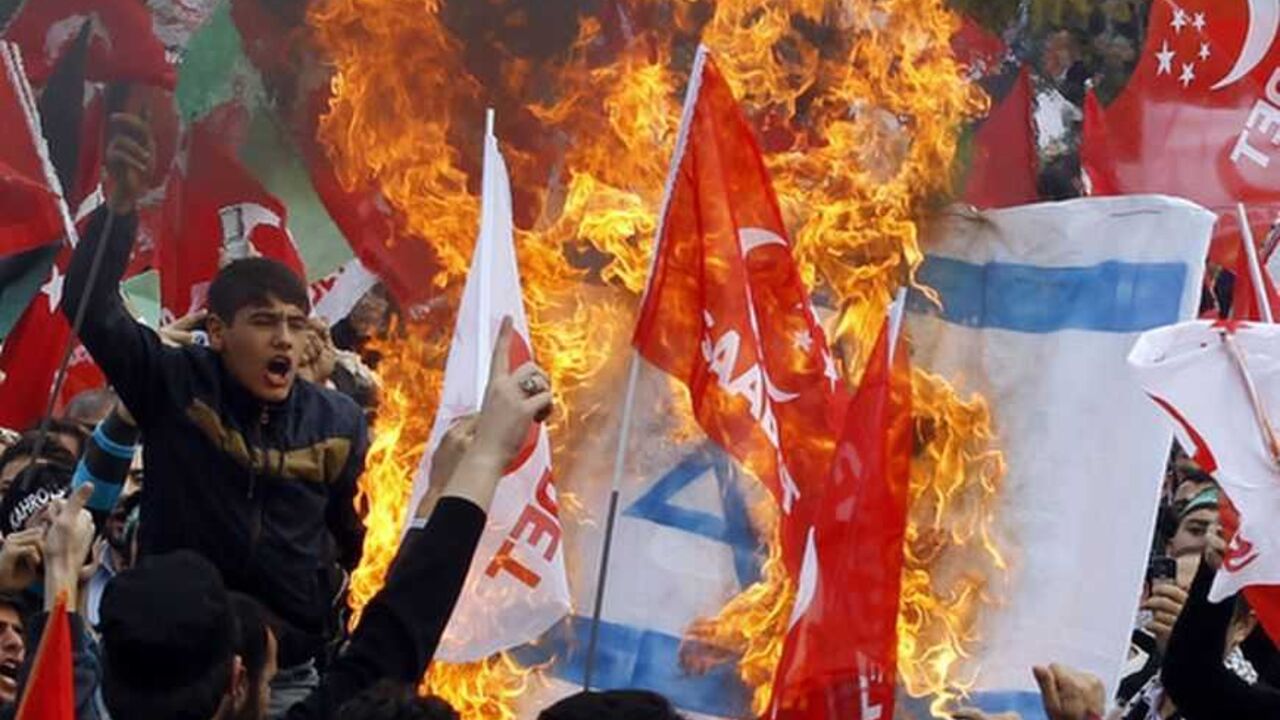 Supporters of the Saadet (Felicity) Party burn an Israeli flag as they shout anti-Israel slogans during a protest in Istanbul Supporters of the Saadet (Felicity) Party burn an Israeli flag as they shout anti-Israel slogans during a protest in Istanbul, December 2, 2012. REUTERS/Osman Orsal (TURKEY - Tags: POLITICS CIVIL UNREST TPX IMAGES OF THE DAY)