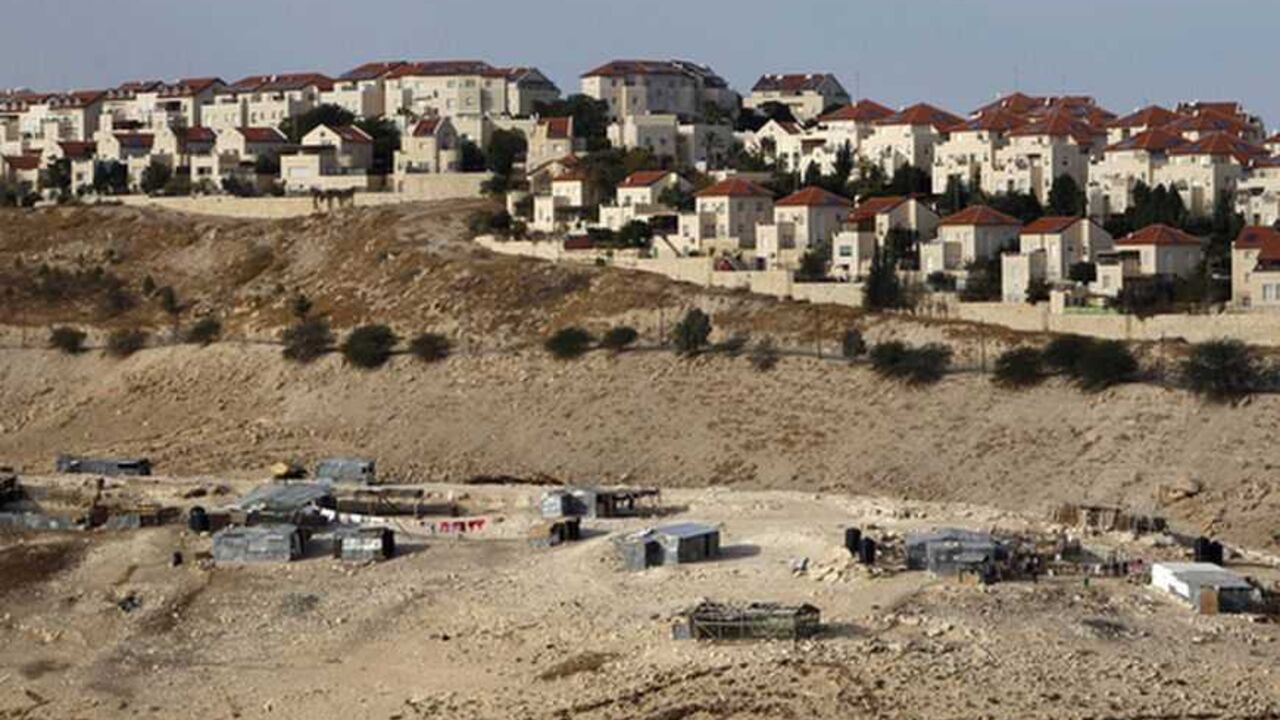 A Bedouin encampment of the Jahalin tribe is seen in front of the Jewish settlement of Maale Adumim, near Jerusalem A Bedouin encampment of the Jahalin tribe is seen in front of the Jewish settlement of Maale Adumim, near Jerusalem December 3, 2012. Israel will not backtrack on a settlement expansion plan that has drawn strong international condemnation, an official in Prime Minister Benjamin Netanyahu's office said on Monday. REUTERS/Ammar Awad (WEST BANK - Tags: BUSINESS CONSTRUCTION POLITICS TPX IMAGES OF THE DAY) - RTR3B60W
