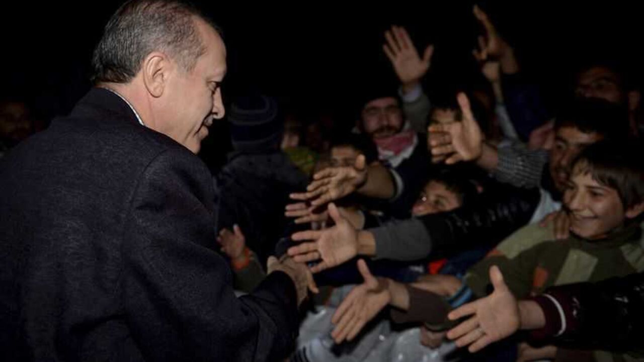 Turkish Prime Minister Tayyip Erdogan shakes hands with Syrian refugees as he visits a refugee camp near Akcakale border crossing on the Turkish-Syrian border, southern Sanliurfa province Turkish Prime Minister Tayyip Erdogan shakes hands with Syrian refugees as he visits a refugee camp near Akcakale border crossing on the Turkish-Syrian border, southern Sanliurfa province, December 30, 2012. REUTERS/Kayhan Ozer/Prime Minister's Press Office/Handout (TURKEY - Tags: POLITICS CONFLICT) FOR EDITORIAL USE ONLY. NOT FOR SALE FOR MARKETING OR ADVERTISING CAMPAIGNS. THIS IMAGE HAS BEEN SUPPLIED BY A THIRD PARTY. IT IS DISTRIBUTED, EXACTLY AS RECEIVED BY REUTERS, AS A SERVICE TO CLIENTS - RTR3BZG7
