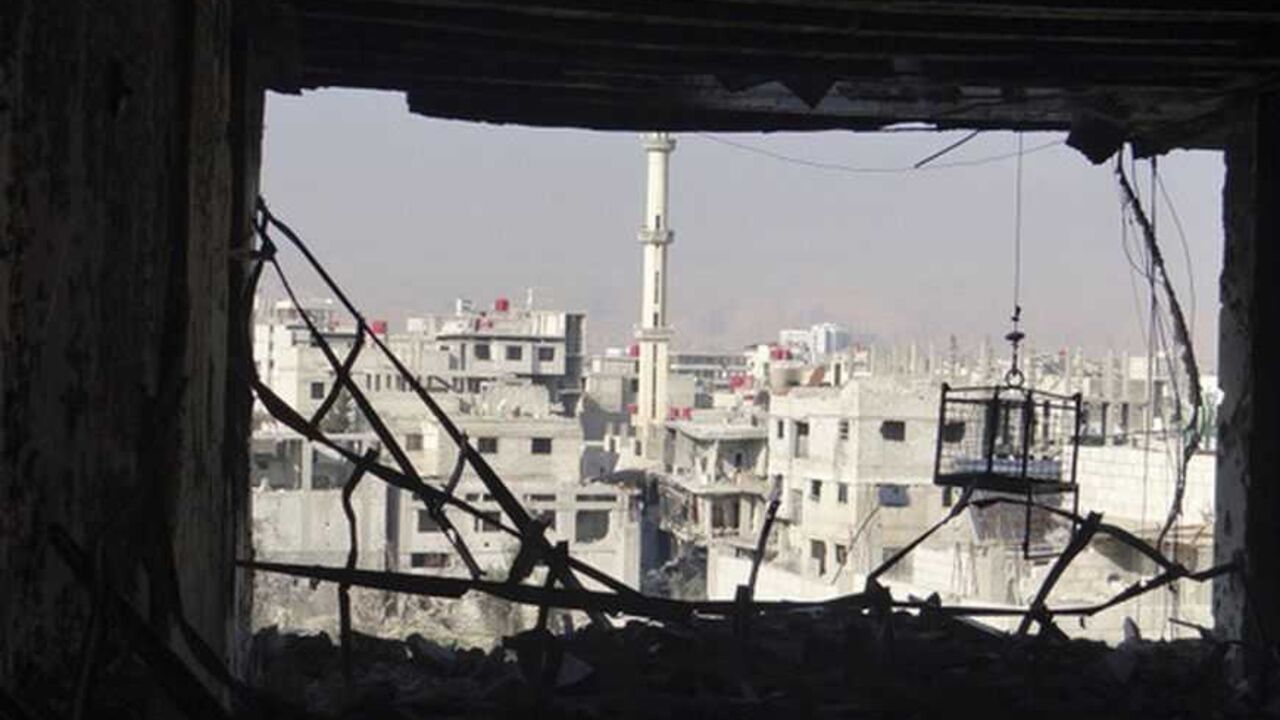 View of buildings damaged by what activists said were shelling by Syrian force loyal to President Bashar al-Assad in Erbeen, near Damascus View of buildings damaged by what activists said were shelling by Syrian force loyal to President Bashar al-Assad in Erbeen, near Damascus December 31, 2012. Picture taken December 31, 2012. REUTERS/Bassam Al-Erbeeni/Shaam News Network/Handout (SYRIA - Tags: POLITICS CIVIL UNREST) FOR EDITORIAL USE ONLY. NOT FOR SALE FOR MARKETING OR ADVERTISING CAMPAIGNS. THIS IMAGE HAS BEEN SUPPLIED BY A THIRD PARTY. IT IS DISTRIBUTED, EXACTLY AS RECEIVED BY REUTERS, AS A SERVICE TO CLIENTS