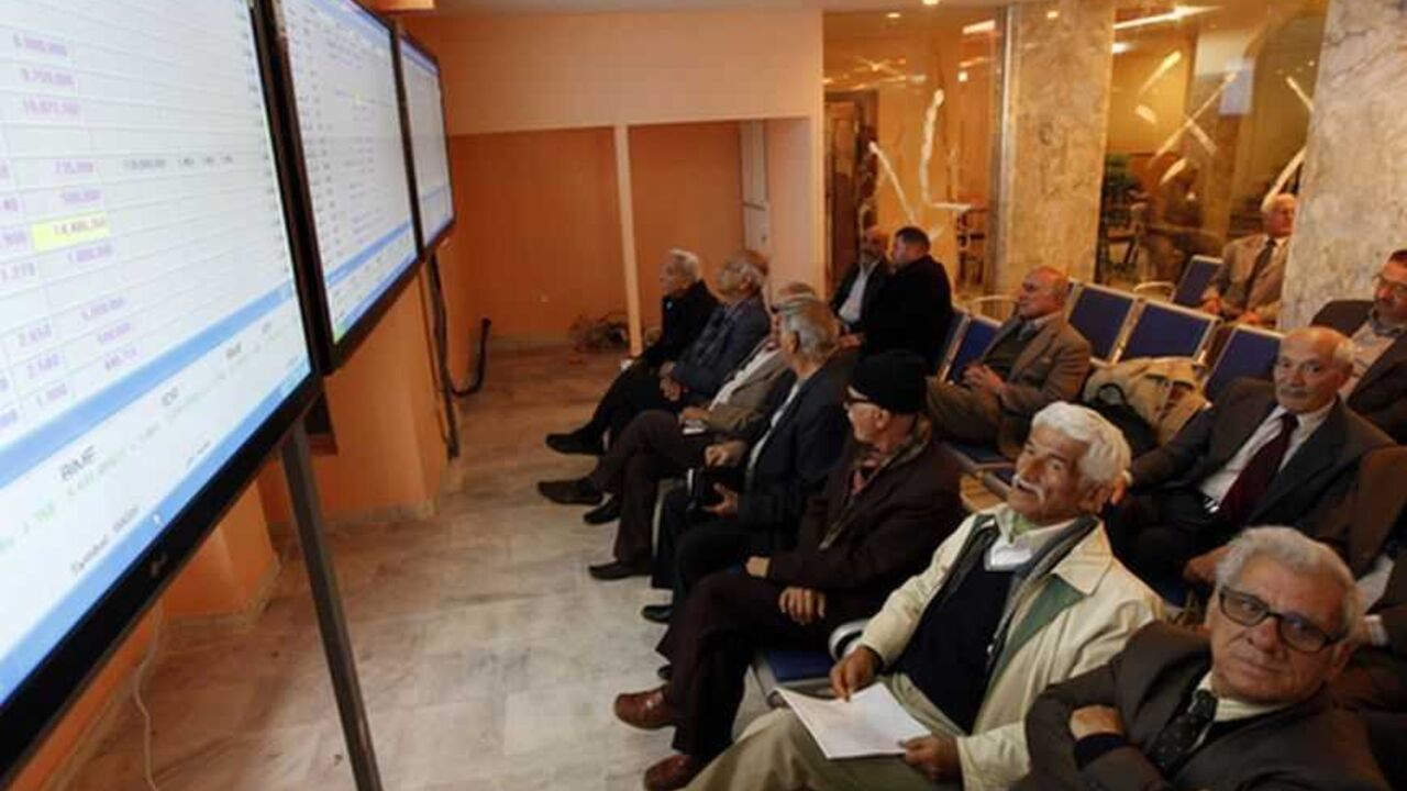 Investors monitor stock information on an electronic board at the Iraq Stock Exchange in Baghdad Investors monitor stock information on an electronic board at the Iraq Stock Exchange in Baghdad, January 7, 2013. REUTERS/Mohammed Ameen (IRAQ - Tags - Tags: BUSINESS)